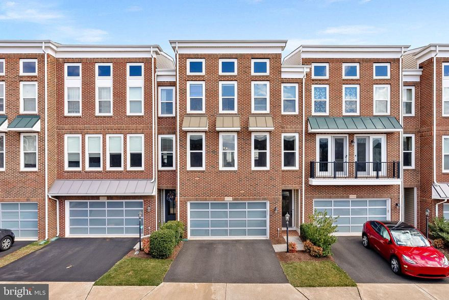This stunning 4-bedroom, 3.5-bathroom townhouse in Brambleton offers over 3,200 square feet of luxurious living space. The main level features a gourmet kitchen with stainless steel appliances, a dining room, a living room, and an additional sitting area. Upstairs, the primary bedroom boasts walk-in closets and a luxury en-suite bath, along with two additional bedrooms, a full bath, and a laundry room. The lower level includes a spacious recreation room, a fourth bedroom, a full bath, and walk-out access to a fenced backyard. Residents of the Brambleton Community Association enjoy exceptional amenities, including multiple swimming pools, play areas, extensive trails, tennis courts, ball fields, parks, and a community center with a fitness facility. Just minutes away, Brambleton Town Center offers grocery stores, banking services, medical facilities, dining options like Blue Ridge Grill and AhSo Restaurant, retail shops, and entertainment venues. With convenient access to major commuter routes such as the Dulles Greenway and Loudoun County Parkway, this home provides the perfect blend of luxury, community, and accessibility.