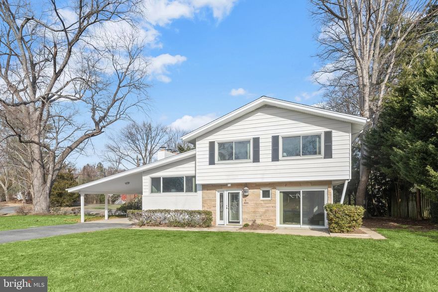 Welcome to Wilenlore Estates in Anne Arundel County, where this beautifully updated split-level residence delivers a polished blend of modern upgrades and timeless style. A welcoming foyer with generous storage opens seamlessly to the sun-filled dining room, highlighted by luxury vinyl plank flooring, abundant natural light, and sliding glass doors leading to the patio, ideal for indoor-outdoor entertaining. The luxury vinyl plank flooring continues throughout the main level, creating a cohesive and sophisticated aesthetic.  The renovated kitchen is a true centerpiece, featuring granite countertops, 36" soft-close cabinetry, stainless steel appliances, a picture window, and direct access to the deck and adjoining breakfast room. The breakfast room is accented with chair railing and wainscoting, offering a comfortable space for everyday meals or casual gatherings.  The upper level showcases a spacious living room with vaulted ceilings and a striking stone wood-burning fireplace. French doors open to a versatile family room or den complete with a wet bar and full bath, ideal for entertaining or flexible living arrangements. The bedroom level provides a private retreat with refinished hardwood floors throughout, including a generous primary bedroom with double closets, two additional bedrooms, and a fully renovated hall bath.  The fully finished lower level further expands the living space with plush new carpeting, a full bath, and flexible areas suitable for a home office, recreation room, or potential additional bedrooms, along with walk-out access to the landscaped grounds.  Recent improvements include a fully renovated kitchen, partially updated bathrooms with the primary hall bath fully renovated, new luxury vinyl plank flooring on the main level, refinished hardwood floors on the upper levels, new carpet on the lower level, updated lighting and electrical package, a new 200-amp electrical panel, and electric and plumbing permits in place. The roof, HVAC, and furnace were replaced within the past five years, per the previous owner. Enjoy proximity to the water and Port to Port Yacht Transport, with boating, walking trails, and kayaking available at Church Creek. Conveniently located near major commuter routes, including I-50 and I-97, this move-in-ready home offers comfort, style, and accessibility in a sought-after community.
