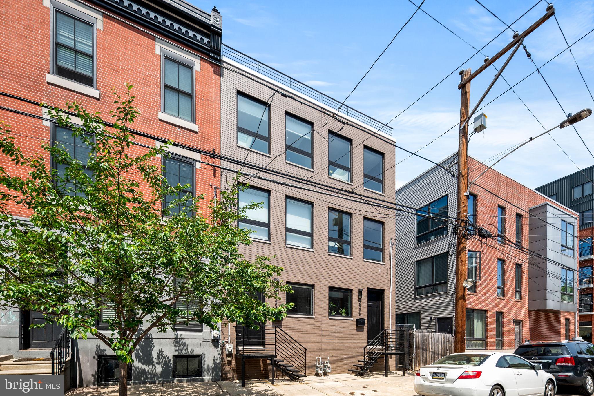 Welcome to 2334 Emerald St...a beautiful 3 bdrm townhouse in the heart of the fun and exciting Fishtown neighborhood in Philadelphia built new in 2020. You are immediately greeted by a spacious, straight through floor, open plan on the 1st floor. The foyer, living room, dining area and full gorgeous kitchen, work together in providing an enjoyable, comfortable and workable living space. The kitchen has a "waterfall" Quartz island, and backsplash, white shaker cabinetry, recessed lighting, & 9ft ceilings. Stunning wood flooring through-out the home. The rear back yard has fencing and provides additional space for entertaining or enjoying that first cup of coffee. The floating staircase leading to the upper floors is stunning. The 2nd level has an open space ideal for either a den, office, library or gaming room. There is a full beautiful bath leading to the 2nd full bedroom. Continue to the 3rd floor the extended main suite is spacious, enjoying lots of natural light, walk in closet, mini bar, and a spa stunning bath complete with a dual vanity. There is direct access to the roof deck with views of the city that afre amazing. The basement is full finished also giving options to create a family room, den, office, 3rd bedroom and has a full beautiful bath. There is ample storage and high ceilings. Dont miss this Fishtown Gem....