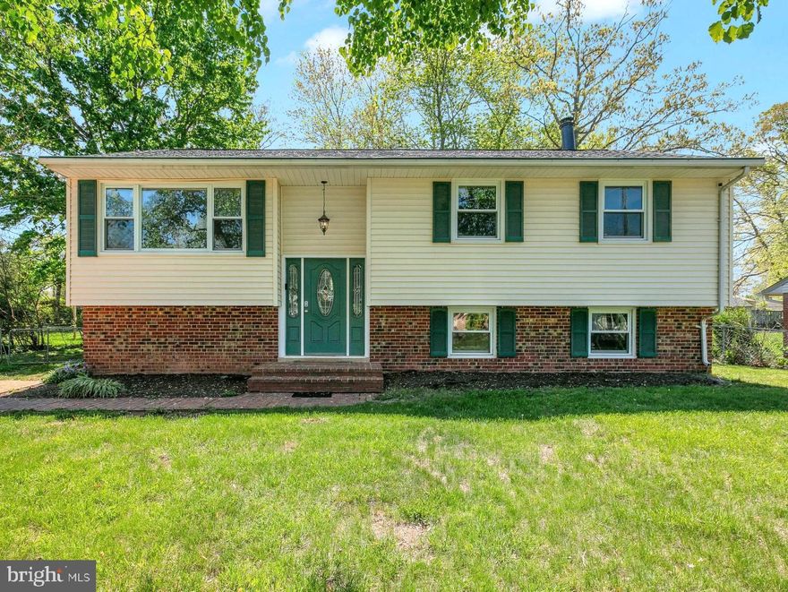 Welcome to 14819 Carlbern Drive. This two-level home features 6 bedroom and 3 full bathrooms on over 2,500 Sqft! Gleaming hardwood floors throughout the main level.  Open living & dining area leads to the 
Updated (2022) Gourmet Kitchen featuring Luxurious Quartz Countertop, Custom Soft Close Cabinets and Stainless-Steel Appliances. Oversized Master Bedroom Suite features large Walk-in Closet and Master Bathroom with Soaking Tub. Additional Three Bedrooms on the upper level with shared 2nd Full Bathroom in the Hallway.  New Floors on the lower level are featured in the large Recreation/Family Room, 2 additional Bedrooms/Flex rooms, New (2025) renovated Full Bath, large Utility/Laundry Room. Lower level also features a rear Workshop/Storage Room. New (2025) Waterproof Laminate Plank floors throughout entire lower level. New Roof in 2022, New Furnace in 2020, New A/C in 2017, New Water Heater in 2017.  Beautiful rear walk down Trex Deck overlooks a large flat, grassy backyard and separate Storage Shed. Quick access to major routes including Rt. 28 and I-66/Express Lanes, few minutes to Wegmans, Trader Joe’s, Giant Food, Fair Oaks Mall, Fair Lakes Shopping Center and more. With no HOA. This charming home is a must-see! Offers if any, are due by Monday 4/28 at 5:00 pm