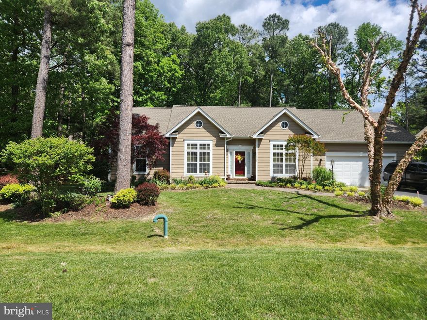 Single floor rambler in a park like setting on fully planted lot with a water feature, seating area off of large screened in porch with room for dining and relaxing. Attached 8x10; storage area and oversized garage for possible small boat storage with drop down staircase to additional storage above garage. Hardwood floors throughout living, kitchen. Dining room and office /spare bedroom. Carpeted bedrooms with Master and Guest bedrooms large enough for King and Queen Size bed. All closets have built in storage systems installed. Master bathroom renovated
with walk in rain shower. Double sink vanity with marble top and full size soaking tub.  Renovated kitchen with large quartz counter top with seating area and skylight. Pantry closet in kitchen and dining room adjacent to kitchen. Large foyer opens in to a beautiful family room with stone fireplace and built in bookcases.  Three year old roof, two year old Hot Water Heater and AC/heat pump system with UV lamp
enhancement. Front lawn and side yard irrigation system. Crawlspace equipped with Dehumidifier, four foundation fans with humidity settings and sump pump. This home has natural light all day long. The large foyer would accommodate a large entry bench and opens up into a warm and inviting family room. The master suite is on one side of the living spaces. All the closets in the additional bedrooms have enough built in shelves allowing room for a work space in each room. The office can be used as a spare bedroom or den. The screened porch can be used 7 months of the year for entertaining, relaxing or eating. The outdoor space would accommodate a fire pit or hot tub. There is a herb garden that grows year round if
the is not a long hard freeze. The community offers an 18 hole golf course, marina with wet and
dry slips, pickle ball and tennis courts, walking trails, community pool, clubhouse and restaurant.