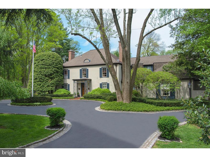 A cobble edged drive winds to an impressive arrival circle & provides the back drop for this classic 6 bedroom 4/4 bath French Manor home. Set on a most spectacular 1.89 flat parcel w/ swimming pool, pool house, tennis court, magnificent gardens & verdant lawns highlighted by perimeter estate fencing & a variety of specimen flowering trees. The formal rms, LR, DR & Library, are connected by a wide transverse Foyer w/ richly stained hand-pegged hardwood floors. To the left find the Library offering an angled wood burning fireplace & south eastern facing windows. Encouraging views of the rear yard & providing access through French doors to the blue stone terrace, the Living Rm sparkles w/ natural light while a wood burning fireplace offers added charm & a focal point on the southern wall. Elegant entertaining is facilitated by the spacious Dining Rm. A 12 paned window & flanking French doors open to the terrace while a swinging service door connects to a granite topped wet bar w/ two service areas & plentiful overhead glass display cabinetry. Under the care of the same family for 30+ years this home was expanded in 2000 by Mahoney builders, creating the desired family space for contemporary, informal living. The Family Rm w/ gas burning fireplace & antique surround. Mirroring some of original millwork of the home find arched inset cabinetry which functions as television storage on one side & lit display space on the other. The Kitchen opens into this family space & offers quality appliances such as double Thermador wall ovens, Viking cooktop & custom outfitting to the cabinetry including sliding spice storage. An additional Office w/ custom shelving provides yet another work or cozy gathering space. Ascend the front or back stair or use the elevator to the expanded 2nd lvl. A flexible floor plan offers as many as 6 bedrooms & 4 full baths. The Master suite currently utilizes two bright rms. The sleeping chamber is highlighted w/ wood floors, decorative fireplace, a wall of closets, as well as a separate walk-in closet & exposure to both the side & rear yards. A neutrally tiled bath connects to what is currently purposed as a 2nd lvl Sitting Rm/Office, rich oak floors & double closets. Four additional family or guest rms, one w/ Jack & Jill bath, the other two w/ en suite baths, offer deluxe accommodations for both family & friends. Exceptionally maintained & improved, ideally located & beautifully presented to the market for the first time in 33 years.