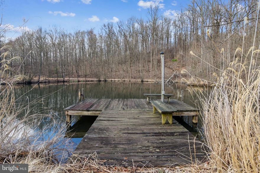 Tour this property from home , from every angle, and see additional photos by clicking on the virtual tour tab for interactive floor plans, or here:https://mls.TruPlace.com/property/600/85488/ Drone aerial video under the virtual tour tab or here: https://iplayerhd.com/player/video/00662e9b-c294-476b-94f1-0a06f173ac82/share   This is THE ONE. Welcome to The Haven, 28 acres of peace and plenty! **Fios is here** Rare opportunity to have a property with no HOA, acreage, pond, privacy, paved road access, AND Fios for high speed, internet, too!  Spring fed stocked pond, dock and boathouse with power.  Just outside of the charming village of Waterford, this contemporary custom built cedar home has walls of windows overlooking your own oasis.   Designed to comfortably house family and friends with a floor plan that offers open space to enjoy, and flexible living spaces...ideal multi generational living, retreat, second home get-a-way, or full time residence. Nearly 5000 finished square feet. Total 4 bedrooms (5 bedroom septic rated for 10 full time occupants), 4 full and 2 half baths. Main level master suite!  New hardwood floors on main level. Gorgeous great room with stone fireplace is the heart of the home and overlooks the deck, pond, and wooded ridge line.   Upper level has bonus room/loft/flex space.  Walkout lower level (with full windows for natural light) has rec room,  kitchen, full bath, half bath, storage.  New roof 2020.Commuter options include easy access to Rt 9/7/15 (no need to take 15, can easily access Rt 9/7 if desired). Convenient to Point of Rocks MARC train (which is working towards extending future service to Amazon HQ2). Property in Conservation Easement.