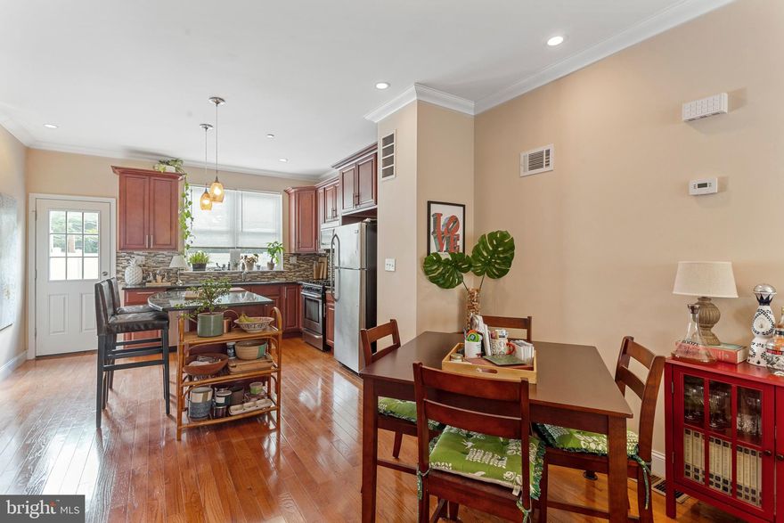 Prime Point Breeze gem with sweeping city views! 3-story newer construction home with remaining tax abatement! Enter the open concept main level with oak hardwood throughout, and space for both living and dining. The open kitchen features granite counters with spacious island, stainless appliances, and oversized 42" cabinets for generous storage. Two sizable bedrooms on the second floor fit queen beds have double door closets in each. The full bath features marbled tile and tub shower for easy maintenance. Third floor primary suite is expansive with lofted ceilings and three closets, including a walk-in. En-suite primary bathroom boasts a double vanity and oversized floor-to-ceiling tiled shower. Full roof deck with breathtaking skyline views from Univ City, Center City, to the Ben Franklin Bridge. Fully finished basement houses an additional entertainment area, laundry, half bath, and extra storage. Just steps to Sardine Bar, On Point Bistro brunch, OCF Coffee Shop, and Tuck Barre & Yoga, this home is perfectly situated in a rapidly expanding neighborhood. Book your showing today! Owner is a licensed PA real estate salesperson.