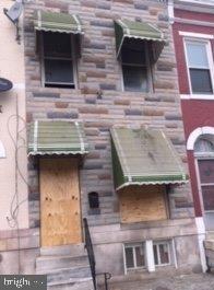 3 level town home with wood floors main level & fenced back area; 1 mile to Druid Hill Park, The Baltimore Zoo, Mondawmin Station & Mall; Close to bus stops, major routes & shopping. Seller financing is available.