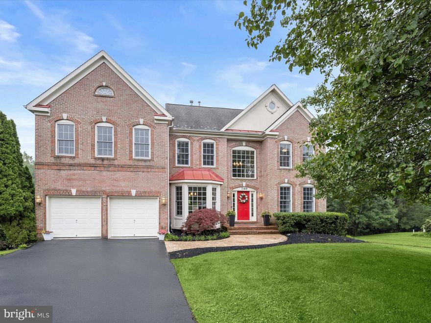 Welcome to this exquisite colonial residence nestled in the highly sought-after Grovemont community of Elkridge! Perfectly sited on a .37 lot of professionally landscaped grounds, this elegant brick-front home offers resort-style outdoor living with a professionally maintained low maintenance , automatic cleaner, heated in-ground pool (resurfaced),a heated hot tub housed in a charming screened-in gazebo, an expansive deck, and a screened deck, overlooking beautiful Rockburn Park, ideal for entertaining!!! Step inside a grand two-story foyer adorned with triple crown molding and newly installed gleaming hardwood floors that flow throughout the main level. The formal living room features elegant traditional columns, plush carpeting, and picture frame molding, while the formal dining room is a statement of sophistication, boasting a bay window, box wainscoting, crown molding, and chair rail detailing. A convenient butler’s pantry with wine storage connects the dining room to the gourmet kitchen, thoughtfully designed with 42” cabinetry, granite countertops, stainless steel appliances, a breakfast bar, center island, and breakfast area with views of the backyard oasis.  The spacious family room is the heart of the home, with natural light pouring in and a cozy gas fireplace for gatherings. A private home office and powder room complete the main level.  Upstairs, retreat to the luxurious primary suite with a French door entry, tray ceiling, sitting area, two closets, including a walk-in, a romantic electric fireplace, and a spa-inspired en-suite bath with dual vanities, a soaking tub overlooking the trees, a walk-in shower, and a separate water closet. Three additional generously sized bedrooms and a well-appointed hall bath complete the upper level.  The fully finished lower level offers LVP flooring throughout and endless possibilities with a full bath, an additional bedroom or exercise room, a wet bar, a game area, a recreation area with a gas-burning fireplace,  and a private sauna for the ultimate relaxation experience.  Landscaped grounds and a two-car garage complete this must-see property! Major commuter routes include I-695, I-95, and MD-100.  Additional highlights include a finished garage with a new floor, updated front sidewalk, HVAC (2018), newer pool and hot tub heaters, new washer and dryer, and numerous updates throughout the home. Front and rear yard sprinkler systems! Enjoy the serenity and convenience of a beautifully maintained community with annual HOA dues of just $335.  A truly exceptional property offering space, elegance, and lifestyle, welcome home!