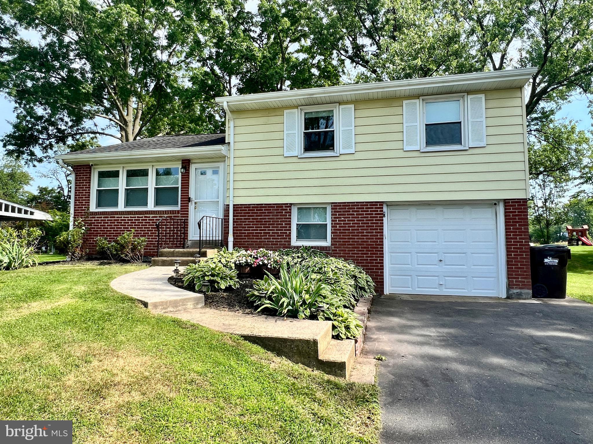 Move in ready single family home in Collegeville where comfort, convenience, and peace of mind are rolled into one. The owner has lovingly renovated this beautiful home during her time here. Step into the open main floor featuring a living room with large windows, seamlessly flowing into an upgraded eat-in kitchen with hardwood floors, plenty of counter space, and a cozy coffee area. Sliders lead to a large paver patio overlooking a private, expansive backyard that backs to open space surrounded by mature trees for added seclusion perfect for relaxing, entertaining, or enjoying the outdoors. The backyard also includes a 12x18 shed with built-in shelves and workbench, ideal for gardening, projects, or extra storage. Upstairs, you’ll find three generously sized bedrooms, a hall bath, and convenient steps to attic storage. The finished basement offers a versatile work/play area, a 1/2 bath, laundry area, an outside exit to the yard, and an attached one-car garage featuring a custom removable bar area—perfect for hobbies or hosting friends. This comfortable home is ideal for entertaining a crowd, but providing many cozy, inviting and highly functional spaces for everyday life. Conveniently located near major routes including 422, PA-29, and PA-113, this home offers easy access to Philadelphia, King of Prussia, and surrounding suburbs. Enjoy the outdoors with nearby Perkiomen Trail for walking, running, and biking, as well as the Schuylkill River Trail and 3 nearby playgrounds.