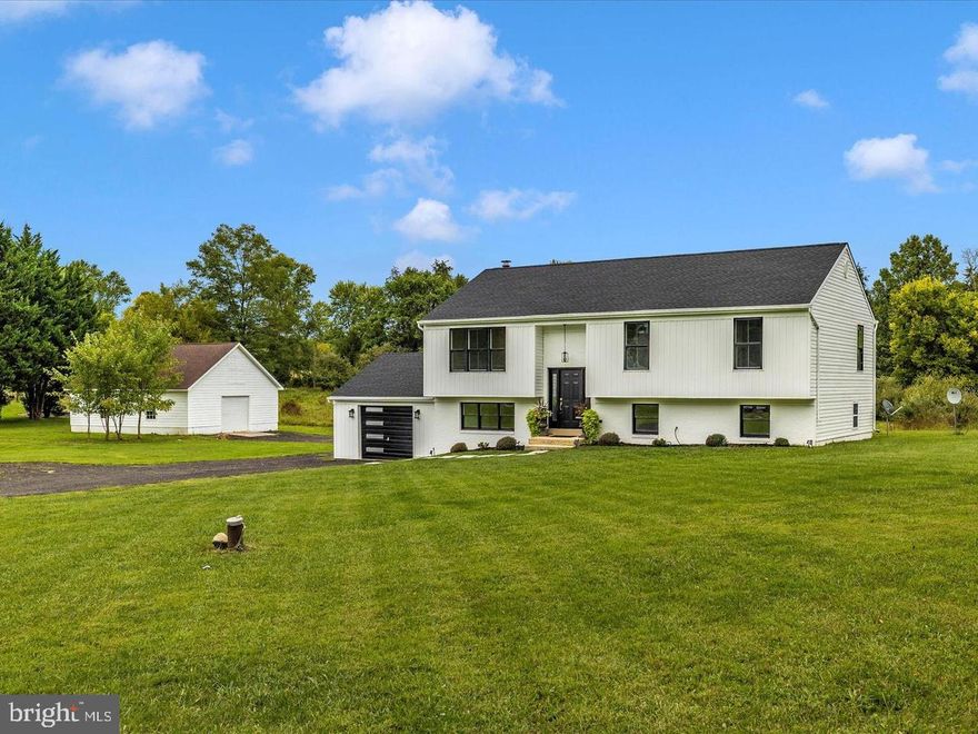 Beautifully Renovated Retreat on 3 Acres in Oakleigh Acres – A Rare Shepherdstown Find with four bedrooms and 3 bathrooms! Welcome to your dream home—a fully renovated, move-in-ready gem tucked away on three-level acres in the highly sought-after Oakleigh Acres community of Shepherdstown, WV. This property delivers the perfect fusion of sleek modern style and serene country living, just minutes from golf courses, Shepherd University, coffee shops, and the scenic Potomac River. Step Inside & Be Wowed! The main level showcases a designer kitchen featuring a bold waterfall granite island, stainless steel appliances, newly installed hardwood floors, new tiled backsplash, abundant cabinetry, and recently professionally painted. Updated lighting fixtures added. Newly updated stylish lighting fixture just added! A brand-new picture window frames a sun-soaked living room with wall molding in the dining and living areas. The open dining area flows seamlessly to a brand-new deck—ideal for hosting or relaxing under the stars. Comfort Meets Style Upstairs: Three spacious bedrooms and three luxurious, fully updated bathrooms provide comfort and elegance, all finished with today’s most stylish touches. Lower Level Bonus Living: Enjoy a massive great room with a cozy brick accent wall, a dedicated office or study nook, and convenient walk-out access to the backyard. A large laundry room adds exceptional storage and utility space.
Dream Bonus Building: Don’t miss the oversized two-story detached building with new electric, perfect for a workshop, studio,  possible garage apartment, loft, or ultimate storage solution. Let your imagination run wild! Get the best of both worlds! Enjoy peaceful rural views, daily visits from deer and wild turkeys, and the freedom of open space—all just minutes from downtown Shepherdstown. Whether you're looking for a retreat, a family home, or a unique work-from-home haven, this one checks every box. Homes like this rarely come available—especially with land, luxury, and location. Put this one on your list today! The home has been meticulously cleaned, and the work is done!