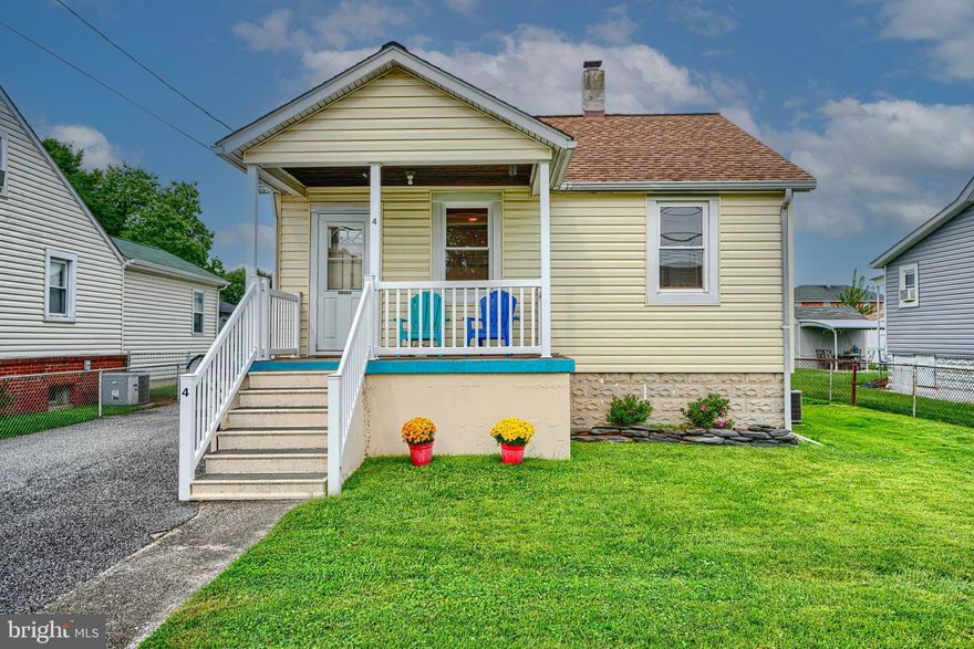Welcome to this charming two-bedroom, one-bath single-family home located in the sought-after water-oriented Inverness neighborhood, where you can catch a glimpse of boats cruising along Bear Creek. The main level offers a comfortable living room, two bedrooms, a full bath, and an updated kitchen featuring quartz countertops, maple cabinetry (2024), and LVP flooring that extends into the dining room addition, which was converted to add an extra 80 sq. ft. of living space. The bathroom was tastefully updated in 2018, and recent upgrades include a new AC condenser unit and basement French drain system installed in 2021. The home boasts a large unfinished basement ready to be finished, offering an excellent opportunity to create additional living space. The basement includes laundry, mechanicals, and a walkout to the backyard, while the attic provides generous storage space or can serve as your personal walk-in closet. Outdoor living is enhanced by a covered front porch perfect for relaxing and enjoying the neighborhood setting, a fully fenced-in yard, a rear Trex deck with vinyl railings (2018), and a one-car detached garage with an adjoining covered patio/carport area. A private driveway provides off-street parking for up to three vehicles. This well-maintained property offers comfort, character, and convenience in a desirable water oriented community. The neighborhood also features a private waterfront park exclusively for residents and members, offering scenic green space, basketball court, picnic tables, playground and access to a community boat ramp (with annual pass / $30). Established and maintained by the volunteer-run Civic League since 1942, the park is a fun gathering place for community events and great place to relax and enjoy the view!