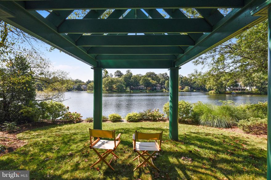 Perfect Waterfront site, tree-sheltered & serene at cul-de-sac's end 3 mi from Wiehle Metro. Over 5000SF Interior w/grand open spaces, angled ceilings, flexible plan, water views. Enjoy Cathedral arched window in gourmet maple, granite, stainless kitchen. Main & lower BRs w/ensuite access to BAs. 2 Home Offices. Updates galore. Relax in your Pavilion or launch your Kayak at water's edge. WOW!