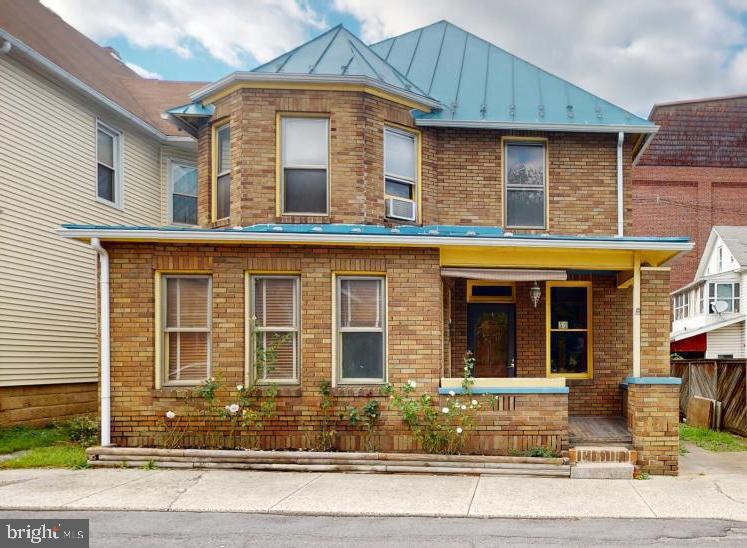 When old world charm meets modern day convenience you arrive at 53 N Church Street! This beautifully maintained traditional brick home is nestled in the heart of Keyser. Although there is living space available on all three levels, this home features the convenience of total living on the first floor if desired. There's a large 2 car detached garage with alley access at the rear. They don't build them like this anymore!!