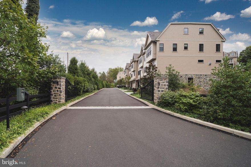 We are proud to offer 13 Overlea Way, a desirable end unit in the private, gated enclave of 13 custom townhomes, in one of the area's most desirable locations.  Beautifully sited on 1.67 ma landscaped acres next to the Morris Arboretum. Overlea offers a turnkey, low maintenance lifestyle, with all the amenities and conveniences today's buyer demands. The finest new construction you have come to expect from Blake Development, one of Philadelphia's premier custom builders. Offering 3500 square feet, including a gracious foyer, powder room and library, formal living room with fireplace, dining room, gourmet kitchen outfitted with custom cabinetry and a Wolf/SubZero appliance package. Enjoy a flagstone terrace and covered balcony, perfect for outdoor entertaining. Third and fourth floors include master bedroom suite with well appointed bathroom and generous walk-in closet. Three additional bedrooms and two full baths. Ample closet space/storage throughout. Just two years "new" this unit is LOADED with upgrades including climate controlled wine storage, the ultimatestereo sound and video, spectacular window treatments, walnut hardwood floors and custom built-in cabinetry throughout. Elevator servicing all four floors completes the package! Heated two car garage with ample storage. Enjoy a premium location, just minutes to Chestnut Hill, Erdenheim Farm and an easy commute to Center City and the Main Line.