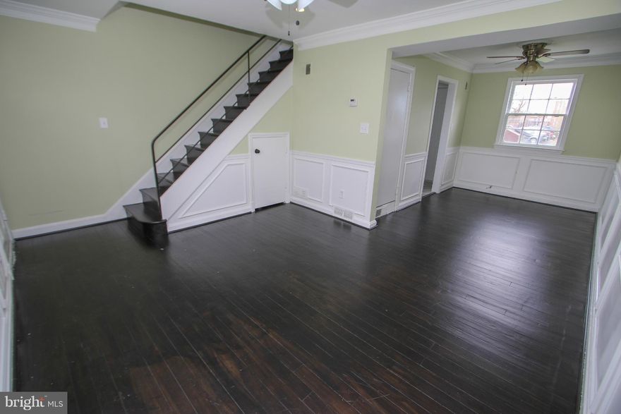 This cozy 2 level home offers affordability and convenience. There are 2 nice sized bedrooms and 1 bath on the upper level. The main level features an open living room/dining room combo with new flooring. Updated kitchen with new appliances and new granite countertops and flooring.  Your new home is just steps away from shopping and bus to 3 metro stations!