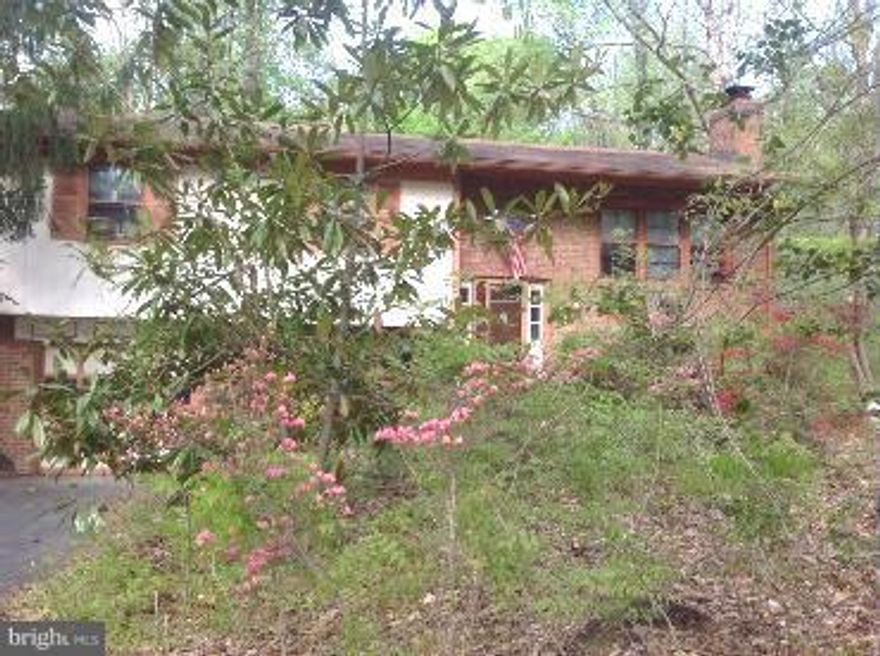 Split foyer, lovely hardwood floors on main level, however,  home is in need of renovation.  SOLD STRICTLY AS IS.  One car garage built in and 2 car garage detached.  This is a great investment!  Seller will review any offers on Sunday 10/30.