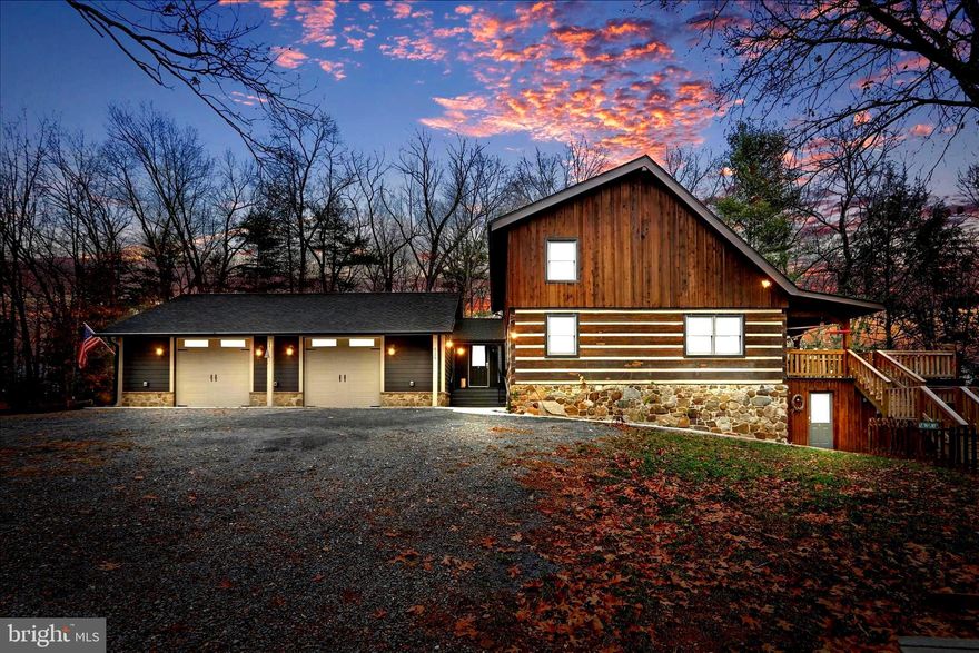 DON'T MISS VIEWING THIS RESTORED LOG HOME WITH FRONTAGE ON THE NORTH RIVER. THE HOME  IS ON  3 ACRES  IN THE  EXCLUSIVE, GATED COMMUNITY OF ICE MOUNTAIN RETREAT SUBDIVISION WITH FRONTAGE ON THE NORTH RIVER IN A PARK-LIKE SETTING.   THE NORTH RIVER IS PERFECT FOR  WADING IN THE HOT SUMMERS , AS WELL AS  FISHING IN SPRING, SUMMER AND FALL. THIS RECENTLY RESTORED LOG HOME HAS 3 LEVELS .  THE PROPERTY HAS A  SECURITY SYSTEM WHICH SURROUNDS THE PROPERTY.  A SHORT WALK WILL TAKE YOU TO THE  SWINGING BRIDGE, WHICH CROSSES OVER THE NORTH RIVER TO THE PRESERVES ON 149 ACRES TO HIKE TO THE TOP OF ICE MOUNTAIN.  THE LOG HOME RECENTLY ADDED AN ATTACHED GARAGE 30'X40' WITH A BREEZEWAY AS YOU ENTER THE HOME. THE MAIN LEVEL HAS A NEW KITCHEN, INCLUDING NEW APPLIANCES, CABINTRY, NEW FLOORING & A COFFEE /DRINK BAR IN THE KITCHEN WHICH FLOWS TO  THE DINING AREA.  THE REMAINDER OF THE LOG HOME HAS HARDWOOD FLOORING. THE OPEN FLOOR PLAN ON MAIN LEVEL HAS A 2-STORY WOOD-BURNING STONE FIREPLACE  FACING THE LIVING ROOM, WITH A LOFT WHICH COULD BE CONVERTED INTO A 3RD BEDROOM, AS IT OVER-LOOKS THE MAIN LEVEL. THERE'S A  BEDROOM  ON THE MAIN LEVEL WITH A FULL BATHROOM. THE  SECOND BEDROOM IS ON THE UPPER LEVEL.  EACH LEVEL HAS A FULL BATHROOM.  THE LOFT WAS USED AS AN ADDITIONAL BEDROOM, WHICH CAN BE ENCLOSED, NEEDING ONE WALL ADDED,  IF DESIRED. THE LOFT OVERLOOKS THE LIVING AREA WITH THE VIEW OF THE 2 STORY STONE  WOOD-BURNING  FIREPLACE. THE BASEMENT IS A WALK-OUT, WITH INTERIOR & EXTERIOR ENTRANCES. THE SELLER RECENTLY REPLACED THE HEAT PUMP & HOT WATER TANK, INSTALLED A NEW  WELL & SEPTIC (RECENTLY PUMPED). THE WHOLE HOUSE GENERAC IS NEWER. THERE'S NOTHING YOU NEED TO DO OR REPAIR IN THIS HOME.  IT'S A SHORT WALK TO YOUR PRIVATE PICNIC AREA WHICH ALLOWS FOR  
WADING OR RELAXING  ALONG THE PRIVATE AREA OF  THE NORTH RIVER .  THIS IS THE MOST COVETED, QUAINT GATED SUBDIVISION IN HAMPSHIRE COUNTY.