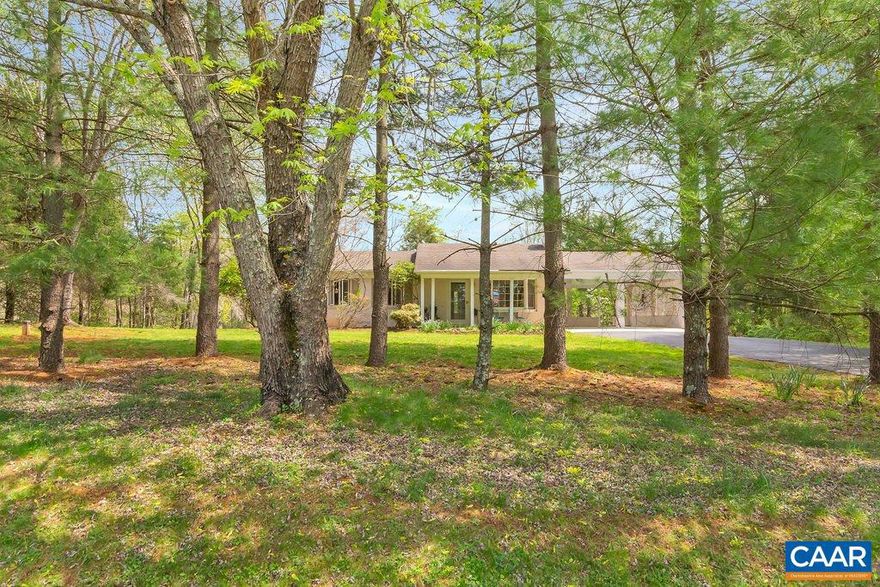 CHARMING 3 bedroom brick COTTAGE set on 1.5 ACRES in western Albemarle is cute as a button and move in ready, with updated kitchen and baths and a brand new roof! The spacious  rec room on the terrace level, with a full bath, wood burning stove and outside access, currently serves as multi-purpose TV room, guest suite and exercise room.  The smaller first floor bedroom could easily become a home office, dining room, or play room.  Pick quarts of blueberries in the summer from the three large blueberry bushes.  Enjoy barbecuing on the new deck, lawn games, gardening and good old country living close to town with NO HOA!,Solid Surface Counter,White Cabinets,Wood Cabinets,Fireplace in Living Room