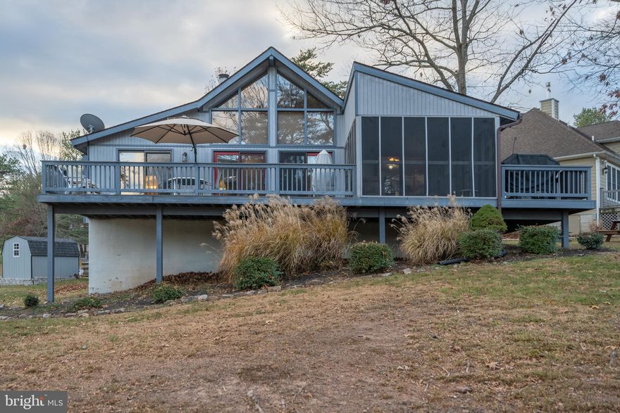 This well maintained Chalet overlooking the 18th fairway at The Woods Resort won't last long! The perfect place to entertain friends and family! This home boasts a large composite deck and screened porch overlooking the Mountain View Championship Course.  Open Great Room with tons of natural light, wood beams, and brick fireplace with insert.  Excellent dry storage in partial basement/crawlspace and storage shed. Situated close to the amenities too! The Woods Resort has so much to offer and the Class A FAMILY membership is available with a $3150 initiation fee. Annual club dues are $2300. Private Club Amenities are not owned or operated by the HOA nor are their dues included in the HOA fees.  The community is nearby the +20k acre Sleepy Creek Wildlife Reserve with miles and miles of trails to enjoy.  Professional photos coming.