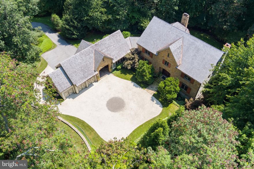 An estate drive leads through a barrel-vaulted archway to a beautiful motor court with surrounding gardens, water fountain and flagstone walkway to the main entrance of this stunning custom built 4 Bedroom luxury home. A 2-story Foyer with gracious oak staircase leads to a Study and incredible Living/Dining Room with oak architectural details, fireplace and built-in bookcases. The gourmet cherry Kitchen with granite and large sunny breakfast area flows to the Family Room with fireplace and beamed ceiling. A home office is adjacent the Kitchen. Main level Laundry Room and private 2-story Guest Suite with sitting room, bath and 2nd level bedroom. A sumptuous Primary Suite includes Primary Bedroom with fireplace, 2 custom fitted Dressing Rooms and spa Bath. Two additional en-suite Bedrooms, one with a large 3rd Level Loft, and Laundry Room are also found on the 2nd Level. The Lower Level features a Rec Room with wet bar, Media Room, Game Room with fireplace, full Bath and Bonus Room. Quarter-sawn oak floors on main level and 2nd floor Hall, custom built-ins, audio and lighting. Ipe hardwood Deck, stone Patio and Terrace, 3-car Garage. Professionally landscaped 3.75 acres in The Residences of Caves Valley Golf Club adjacent to the 12th green!