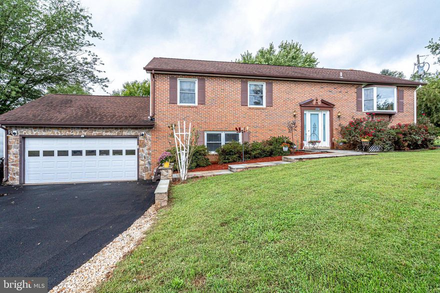 ***BACK ON MARKET! ***Welcome to you new home, with the perfect balance between living in the "country", yet still being within easy reach of all that Northern Virginia has to offer! Situated on almost an acre lot, with a large level front and back yard, family football games will become a tradition! Plenty of parking in the large driveway, accented with gorgeous flagstone retaining walls and walk way. Enter your home and breath a sigh of relief, as the love and care that has gone into this home by the previous owners is evidenced by the positive aura of the home. Warm hardwood floors adorn the upper level, which flows from a light and bright living room, into the formal dining room and open kitchen. The kitchen has been updated with modern finishes, such as stainless steel appliances and granite countertops. The large peninsula will be a favorite spot to gather around at the end of the day to share stories of the day, complete homework, or enjoy an informal meal.  The adjacent screened in deck (with composite decking) is another great spot to appreciate the peacefulness of the lush green backyard. The stairs from the deck lead down to a flagstone patio - what a great location to soak in some sun, grow a vegetable garden, or just read a good book! After an exhausting day, head to one of the three upper level bedrooms, one with an ensuite bathroom. The lower level offers even more space, with a large family room, complete with fireplace (with wood stove insert to keep it cozy) and built-ins. Another bedroom, a large recreation room (with access to the patio and garage), laundry area, storage room, and half bath are also found on this level.  The home has undergone many recent updates, including fresh paint, newer carpeting (2020), newer kitchen appliances, newer roof (2016), and a new sump pump. Book your tour today, you won't be disappointed!