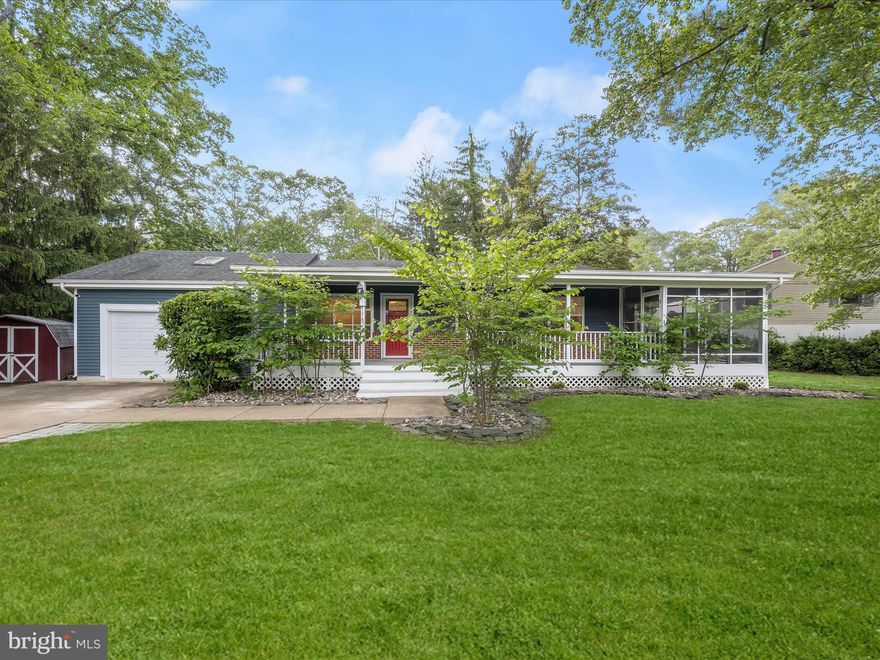 ***Offer deadline set for Monday May 12th at 12 noon*** Tucked into the Arden on the Severn community of Crownsville, this charming ranch-style home sits proudly on a corner lot, a short distance from Sunrise beach, boat ramp, and picnic pavilion on the Severn River. With a welcoming blend of indoor comfort and outdoor living, it offers both convenience and a connection to nature. A covered front porch leads to a screened side porch, perfect for enjoying peaceful mornings or breezy summer evenings. Step inside to a bright and airy living room featuring a bay window, crown molding, and a neutral paint palette that flows throughout the home. A step down and the layout opens up dramatically. Cathedral ceilings and generous natural light define the main living space, where the family room, complete with a cozy pellet stove, flows seamlessly into the kitchen and dining area. The kitchen is both functional and stylish, offering upgraded countertops, stainless steel appliances, cabinetry with roll-out shelves, and a breakfast bar for casual meals or extra prep space. It overlooks both the dining and family rooms, keeping everyone connected. The dining area features a sliding glass door that leads to a composite deck, great for grilling, relaxing, or entertaining outdoors. A full bath just off the living room includes a jetted soaking tub with a beautiful stone surround, and an adjacent open nook is ideal for a desk or reading space. The bedroom wing of the home can be closed off with a pocket door, offering privacy and separation from the main living areas. At the far end of the hallway, the primary bedroom provides a quiet retreat, while two additional bedrooms share a second full bath. This bathroom includes a vessel sink and a floor-to-ceiling tiled shower with a frameless glass enclosure, combining modern design with function. Out back, the composite deck extends into a partially fenced portion of the yard, an ideal area for pets. There’s also additional green space and a side yard, along with two storage sheds for tools, lawn equipment, or seasonal décor. A driveway provides off-street parking for multiple vehicles. Recent updates add peace of mind, including a new washing machine, a 2022 HVAC system, a new well holding tank (2024), a garbage disposal, and a  backup generator. With its open layout, inviting outdoor spaces, and prime location near community water access, this home offers a relaxed lifestyle in one of Crownsville’s most sought-after neighborhoods.