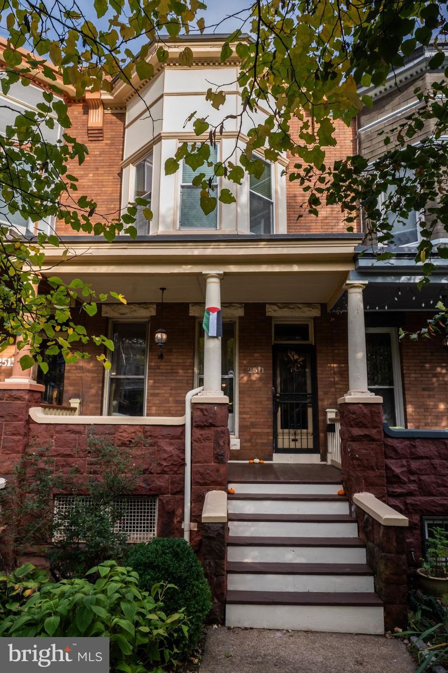 Homes in the 2500 block of Guilford Ave remain one of Charles Village's best-kept secrets offering many original details, generous room sizes, a peaceful, sylvan setting and great neighbors. Circa 1907 the property at  2511 Guilford Ave features hardwood floors w/inlay, built-in mantels, cabinets, wardrobes, transoms, a bay window, cedar closets & window seats. Updated kitchen with granite island & counters, tile backsplash and stainless appliances. New refrigerator & microwave. Enjoy the magic hour of golden sunlight from the comfort of the front porch, living room or primary bedroom. The backyard provides an oasis of calm that can be enjoyed from the glider swing beneath the giant maple, while dining al fresco on the patio, sitting around a fire or from the skytop retreat of the 2nd floor porch.  Convenient to Penn  Station, JHU Homewood, Charm City Circulator, 26th Street Green, Waverly Farmers Market, Wyman Park Dell, Union Memorial Hospital, downtown, shopping, restaurants and cafes. Subject to CVCBD surtax FY2025/26 - $395.