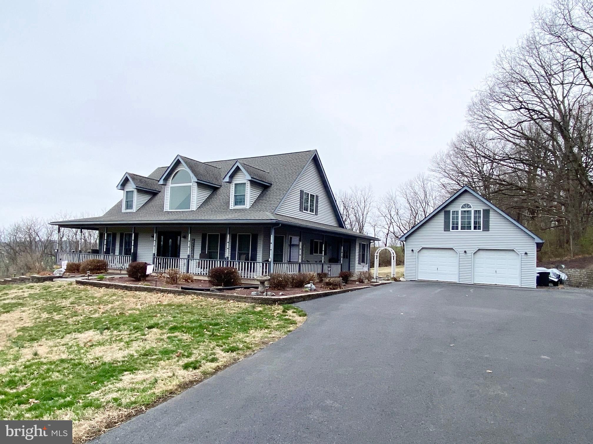 Offers Received! All offers need to be submitted by 4 pm on Monday April 7th! This well-kept spacious cape cod is ready for new owners! Located with a rural setting, yet close to Rte 222, Route 183, and within minutes to hospital, stores, and restaurants! Situated on 4.7 acres, this cape cod has plenty of room for entertaining both on the exterior and on the interior! The house has plenty of natural sunlight from the large windows and skylights! The front walkway will lead you to a wrap around porch where you can sit and watch the wildlife and see the beautiful scenery. As you enter the front door, hardwood flooring will welcome you. Straight ahead is the living room that has a brick fireplace with pellet stove, hardwood flooring, and vaulted ceilings. The large kitchen has 2 skylights, island, dinette area, and 38 cabinets. All the appliances will be remaining! Holiday meals can be served in the dining room. There are 2 bedrooms on the first floor. The master bedroom has 2 skylights, walk-in closet, and a slider that leads to the rear deck. The ensuite consists of a double vanity, jetted tub (current owner never used), and a shower stall. The 2nd bedroom is currently being used for an office area. The hall bath has tile flooring and walk-in shower. There are 2 bedrooms on the 2nd level, along with a full bath with double vanity. Both bedrooms have plenty of storage with the walk-in storage area in the eves. The daylight finished basement area is phenomenal for your holiday parties! The double door and full size windows give plenty of natural light. There is a wet sink kitchenette area, along with a full bath in the basement! In addition to the finished area, there are additional closets and utility room that allows plenty of storage. If you like to entertain in the summer, the rear deck and yard are perfect for your parties. And...for the handyman that needs work area, there is a detached garage that has full staircase leading to the workshop or storage area on the 2nd floor. There are even skylights in the garage! The original heating system for the house was oil, hot air heat and electric baseboard for the basement. However, the current owners use 2 pellet stoves to heat the house. And there are approximately 4 tons of pellets included in the sale. Recent upgrades include 2 new garage door openers, new kitchen refrigerator, 3 new toilets, new chimney cap, fireplace insert.
