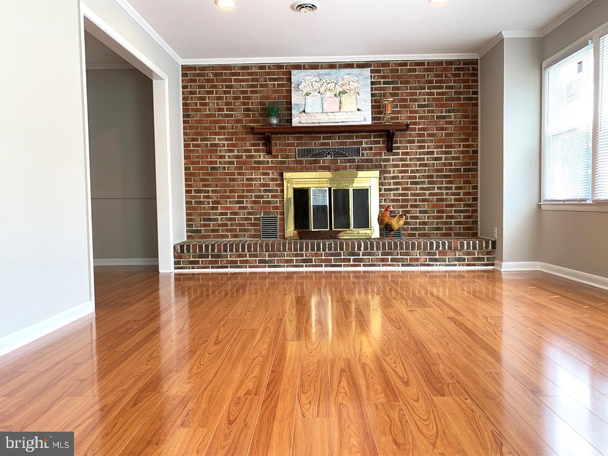 Spacious 4 bedrooms house has new central A/C, new windows, granite countertop, new stove, washer & dryer. Finished basement has a fireplace. House is close to Rt 695, Close to stores and restaurants.
