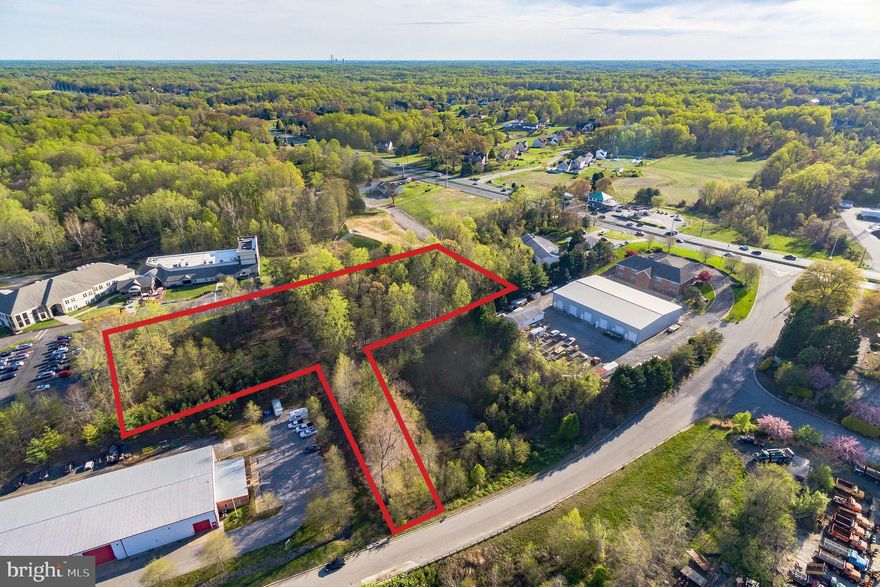 2+ ACRE COMMERCIAL PROPERTY LOCATED PROMINENTLY ALONG THE ROUTE 2/4 SPLIT IN CALVERT COUNTY, MD!  OWNER FINANCING AVAILABLE!!!! This is a PRIME LOCATION - among an existing industrial hub, adjacent to well-established businesses including Morgan E. Russell, Walton's Welding, Fabrication, and Scheibel Construction.  This property is zoned for commercial light industrial which is ideal for businesses requiring light industrial operations. INCREDIBLE BUILDING POTENTIAL - possibility to construct a 6500 square foot building with use of existing plans & ample space for parking and loading/unloading docks. EXPEDITED PERMIT PROCESS! Benefit from a streamlined permit process for quicker construction. ENGINEERING PLANS AVAILABLE: Full engineering plans for a 6500 square foot building are readily accessible.  BENEFIT FROM THE SAVINGS of utilizing the seller's existing ENGINEERED CONSTRUCTION PLANS, from well and septic, to storm water management to building plans.  Permit renewal required: Although the previous permit has expired, it can be renewed to proceed with the construction. LOCATION, LOCATION, LOCATION! This location benefits from high visibility and exposure to the public due to it's advantageous position along the major commuter route 2/4 split. With over 32,000 commuters passing daily, businesses established here can capitalize on the significant daily traffic flow. This level of exposure provides excellent opportunities for attracting potential customers and maximizing business visibility. Schedule your showing & appointment to review the property and plans today!