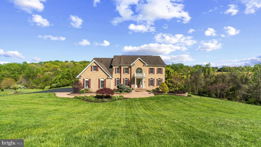 Welcome to 2301 Willow Vale Ct—where luxury meets lifestyle on nearly 3 pristine acres in the heart of Fallston. Perfectly positioned in the coveted Willow Vale Farms community, this stately 9,000+ sq ft home is a masterclass in elegance, craftsmanship, and thoughtful upgrades.

From the moment you arrive, the commanding brick façade, professional landscaping, and dramatic double staircase foyer set the tone. Inside, the home has been freshly painted throughout, boasts gleaming hardwood floors, and coffered ceilings and elegant trim that elevate the feel of every space. The gourmet kitchen is a chef’s dream—complete with a massive 11’ island, exposed beams, brick backsplash, and brand-new gas cooktop. Entertain seamlessly in the sunroom with vaulted ceilings and skylights or relax in the grand family room with 20’ ceilings and a cozy stone fireplace.

Upstairs, the palatial primary suite boasts hardwood floors, a private sitting area, two walk-in closets, and a spa-inspired bath with a multi-head shower and jacuzzi tub. Each secondary bedroom has hardwood floors and its own en-suite bathroom—luxury and privacy for all.

The finished lower level is an entertainer’s playground: home theater with projector and surround sound, full second kitchen and bar, gym, bonus room, and a potential 5th bedroom with Jack & Jill bath.

Outside, enjoy the peaceful wooded backdrop from your expansive 39’ x 25’ composite deck—complete with a built-in gas line for grilling. A brand-new furnace, updated appliances, oversized 3-car garage, and meticulous care make this home truly move-in ready.

This is not just a house—it's a statement.