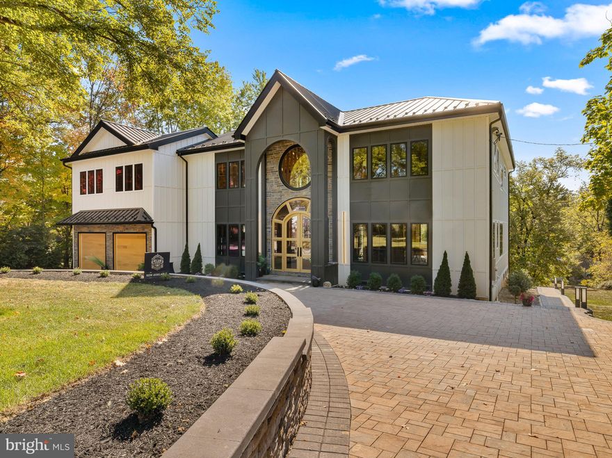 Enter a world of unparalleled luxury with this distinguished new construction home, where every detail reflects your unique style and preferences. Discover the pinnacle of personalized luxury, where interior finishes are not just chosen, but crafted to your taste. From selecting premium materials to designing custom layouts, this property offers endless possibilities for creating your dream living space, tailored precisely to your desires. Crafted with the utmost care and precision, this residence stands as a testament to enduring strength and durability. Constructed with high wind-resistant premium fiber cement Hardy exterior, it ensures unmatched resilience against the elements, promising years of worry-free living. The standing seam metal roof offers not only protection but peace of mind. Engineered to withstand all weather conditions, it provides a secure shelter in any environment. But it's not just about durability—it's about efficiency too. This home boasts an energy-efficient design, with its metal roof specially designed to reflect the sun’s UV rays, allowing you to enjoy both comfort and cost-effectiveness year-round. As you approach the residence, you are greeted by impressive automatic smart gates, effortlessly welcoming you onto the property with an air of modern sophistication. The paver driveway and walkways are laid out in a pattern that exudes both style and practicality. Your gaze is drawn upwards to the grand arched portico, an elegant architectural feature that commands attention with its stately presence. Framing the entrance with timeless grace, the portico hints at the grandeur awaiting within, setting the tone for the luxurious experience that awaits beyond its threshold. An elegant layout featuring four lavish bedrooms, each boasting its very own ensuite bathroom, ensuring the utmost comfort and privacy for you and your guests. A flex space that can be utilized as an office or library reflecting a commitment to luxurious living at its finest. From the moment you step through the grandiose two-story foyer, adorned with a custom-made, arched, solid hardwood white oak grand entryway, featuring triple panel slabs and seven individual sidelights, you're greeted by an ambiance of sophistication and elegance. Oversized Pella fiberglass windows and skylights allowing for natural sunlight to flood the space, enhancing its allure. The entire first level boasts 10-foot coffered ceilings, adding a sense of grandeur and spaciousness to the living areas. Indulge in the culinary masterpiece that is the chef's kitchen, meticulously designed to inspire your culinary creativity for hosting memorable gatherings. Off of the family room and kitchen, you'll find 8-foot sliding glass doors leading out to the expansive 2,000 square foot deck with Zuri decking, ideal for year-round entertaining.The lavish primary suite offers a luxurious retreat, boasting a striking 16-foot cathedral ceiling and an opulent en-suite complete with not one, but two glass-encased showers, a deluxe tub, sauna, four skylights and his and hers custom closets. Entertainment excellence in the partially finished 1,700 square foot lower level, thoughtfully crafted to cater to both comfort and entertainment, ensuring an elevated lifestyle experience for you and your guests. Completing the allure of this remarkable property is the garage, housing two cars comfortably, the garage is equipped with custom solid hardwood doors, seamlessly blending style with functionality, and effortlessly controlled by smart openers for convenience. Step inside to discover the extraordinary 12-foot ceilings, providing ample vertical space and a sense of expansiveness. But that's not all – ensuring optimal comfort year-round, the garage is equipped with an air conditioning system, courtesy of a mini-split unit, promising a pleasant environment regardless of the outside temperature. This Chestnut Hill residence is more than just a home—it's a testament to luxury living.