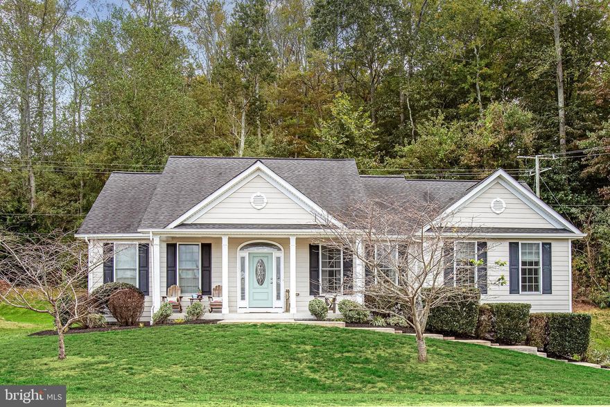 3.375% assumable loan for qualified buyers—an incredible opportunity you don’t want to miss!

Welcome to 6316 Vista Court in the sought-after Potomac Landing community—where river living meets everyday convenience. This beautifully finished 3-bedroom, 3-bath rambler offers nearly 3,000 square feet of inviting space, tucked on a landscaped cul-de-sac homesite.

Here, life moves at a relaxed, coastal pace. Cruise by golf cart to Tim’s II at Fairview, Sam’s Pizza & Subs, or the full-service marina. Spend weekends on three private sandy beaches or kayaking and canoeing on the community fishing lake. This is river-community living at its best.

The home makes a striking first impression with its neutral HardiePlank exterior, bold black shutters, and charming columned front porch. The freshly painted side-load garage is a standout—epoxy floors, upgraded lighting, and even a mounted TV setup create the ultimate space for car lovers or hobbyists. Out back, a brand-new composite deck transitions seamlessly to a stone terrace, overlooking a gently sloping yard framed by lush greenery—perfect for sunset gatherings.

Inside, sunlight pours across gleaming hardwood floors and an airy open layout. The spacious living room, framed by bay windows, feels warm and welcoming. The kitchen shines with walnut-toned soft-close cabinetry, granite countertops, a large island, and recently upgraded KitchenAid appliances. A bright breakfast nook captures backyard views, while the nearby laundry room offers cabinetry, a utility sink, and natural light.

The primary suite is a peaceful retreat with oversized windows, a walk-in closet, and a spa-inspired bath featuring dual vanities, a jetted soaking tub, and a walk-in shower. Two additional bedrooms and a full bath complete the main level.

Downstairs, the finished basement expands your options—featuring a generous entertainment area with mounted TV setup, a full bath, a carpeted flex space (ideal for guests or a home office), and ample storage. There’s even direct access to the pristine garage. Major systems, including HVAC and water heater, have been meticulously maintained.

Location seals the deal. Enjoy quick access to Downtown Fredericksburg (about 25 minutes), multiple I-95 exits and VRE stations, and easy commutes to Naval Support Facility Dahlgren (just 20 minutes). Everyday essentials at the Shops at King George are less than 10 minutes away.

Comfort, community, and river access—all wrapped into one exceptional home.
Schedule your showing today before it’s gone!