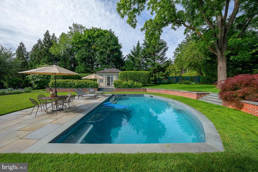 A rare offering in Northside Villanova, this exceptional 1.5 acre French Country estate sits on a premier cul-de-sac, combining privacy, luxury and timeless design. A 2018 renovation blends dramatic floor-to-ceiling windows with an open, modern layout for effortless living and entertaining.  A courtyard entry leads to views of the pool and walled gardens. The chef’s kitchen opens to a spacious great room overlooking the grounds, pool, spa, terraces, and pool house. Features include 5 en-suite bedrooms, 6 full and 2 half baths, and a finished daylight lower level with a gym, bar, media room and wine cellar. 

Professionally designed landscaping, a European-style gravel motor court, Belgian block detailing, and bluestone-capped walls enhance the setting. A Vermont slate roof, copper gutters, detailed millwork, and custom railings complete this one-of-a-kind offering—originally designed by renowned architect Walter K. Durham.