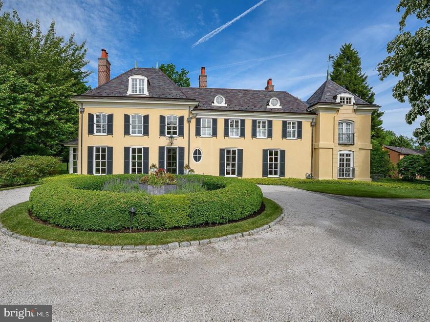 A rare offering in Northside Villanova, this exceptional 1.5 acre French Country estate sits on a premier cul-de-sac, combining privacy, luxury and timeless design. A 2018 renovation blends dramatic floor-to-ceiling windows with an open, modern layout for effortless living and entertaining.  A courtyard entry leads to views of the pool and walled gardens. The chef’s kitchen opens to a spacious great room overlooking the grounds, pool, spa, terraces, and pool house. Features include 5 en-suite bedrooms, 6 full and 2 half baths, and a finished daylight lower level with a gym, bar, media room and wine cellar. 

Professionally designed landscaping, a European-style gravel motor court, Belgian block detailing, and bluestone-capped walls enhance the setting. A Vermont slate roof, copper gutters, detailed millwork, and custom railings complete this one-of-a-kind offering—originally designed by renowned architect Walter K. Durham.