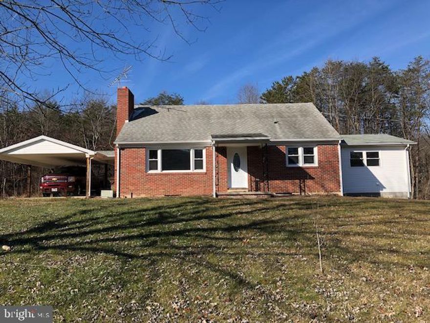 Lovely Brick cape cod that is move in ready.  New flooring and freshly painted.  4 bedrooms, 1 full bath and 2 half baths. Three bedroom septic.  Bonus room off of kitchen.  3.9 acres will be surveyed off.  Great mountain views.