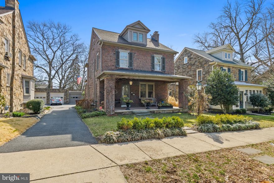 This architecturally distinguished detached brick residence was built in 1926 and is ideally situated in Wilmington’s sought-after Highlands neighborhood. A gracious covered front porch spanning the width of the home sets the tone for the timeless elegance found within. The main level features a grand living room with fireplace, leading to an impressive dining room with sitting area and powder room. The white kitchen is thoughtfully positioned with an adjoining mudroom and stainless steal appliances and has direct access to the rear patio, creating effortless indoor-outdoor living. The second level offers a generous primary bedroom and two additional bedrooms—one with a versatile attached sunporch that leads to roof-top deck - perfect for summer evenings. A beautifully updated marble bath completes the second floor. The third floor serves as a private suite with an updated bath featuring a soaking tub, providing a serene retreat or elegant guest quarters. Throughout the home, refined architectural details abound, including refinished hardwood floors, solid wood doors with original hardware, stained glass windows and classic moldings. The fully fenced, meticulously manicured rear yard with brick patio creates an intimate setting ideal for firepit evenings. A driveway and one-car garage complete this exceptional offering. Enjoy refined city living with unparalleled walkability to neighborhood shops and restaurants.