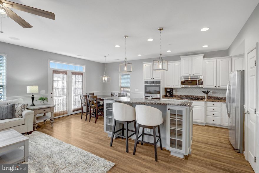 Welcome home to this beautifully updated 3-bedroom, 2.5-bath end-unit townhome in the sought-after Kirkpatrick Farms community of Aldie! With over 2,600 sq. ft. of living space, this home offers the perfect blend of comfort and style.

Step inside to fresh paint and brand-new carpet throughout, creating a bright and inviting atmosphere. The sun-filled living room provides the perfect space to relax, while the spacious dining room is ideal for holidays and family gatherings. The white kitchen cabinetry, new double oven, stainless steel appliances, granite countertops, and upgraded flooring in the kitchen and family room make this space both elegant and functional. The gas fireplace adds warmth and charm to the open-concept family room.

Upstairs, the spacious primary suite boasts a tray ceiling, two walk-in closets, and a luxurious en-suite bath with dual vanities and a standalone shower. Two additional bedrooms on the upper level provide plenty of space, along with another full bath. The convenient upper-level laundry room includes a sink for added ease.

Enjoy outdoor living with a balcony off the main level, perfect for relaxing with a cup of coffee. The brick facade and one-car garage complete this fantastic home.

Located in an amenity-rich community with tennis courts, basketball courts, fitness center, walking trails, a pool, playgrounds, and more, this townhome is just minutes from shopping, dining, and major commuter routes.