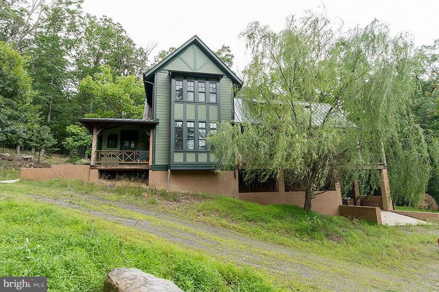 Luxury Renovated. Gated community, nestled against Cacapon State Park. Privacy is the standard. With each home sitting on it's own 10-20 acre home site. This Tom Shiner designed home offers amenities galore! Starting with a timber frame made of 300-400 year old Douglass Fir reclaimed from the St. Lawrence Sea Way.The perfect combination of nature and luxury.