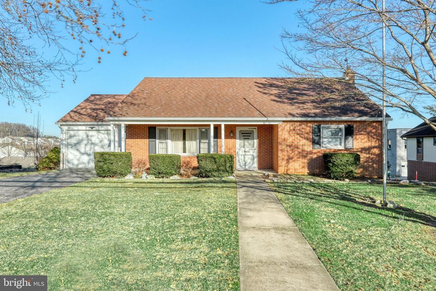 Minutes to I83, schools and parks! Don't miss this solid home needing some cosmetic updates. Spacious kitchen, living room, full bath & two bedrooms on main floor.  Two bonus rooms upstairs, plus more finished space in basement with wood burning stove, shower, sink and laundry. Two separate garages and plenty of parking. New hot water heater & newer furnace.