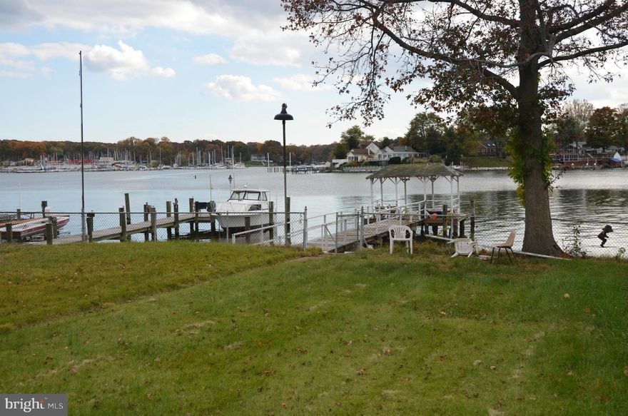 BUILD YOUR DREAM HOME!  WATERFRONT TEAR DOWN RECOMMENDED WITH PRIVATE PIER AND DEEP WATER IN CHARMING BAR HARBOR----EXPANSIVE VIEWS--PUBLIC WATER AND SEWER--ESTATE SALE BEING SOLD AS-IS--DETACHED SHED/GARAGE GIVES EXTRA COVERED AREA FOR THE LOT--APPROX 45-50 FT OF WATER FRONTAGE---CASH, CONSTRUCTION OR REHAB LOAN WILL BE NEEDED.