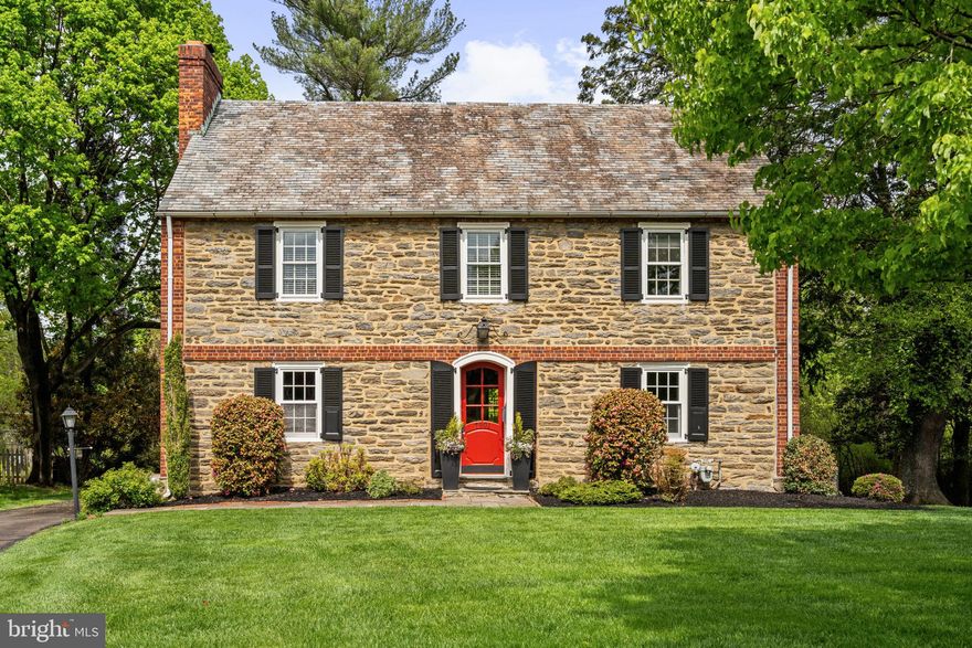 *This home qualifies for a 1% interest rate reduction for the 1st Year at ZERO cost to the buyer when using our preferred lender*

Positioned on a quiet, desirable street in Laverock, this stately center hall stone colonial showcases timeless architecture, refined updates, and exceptional curb appeal.

Set on .36 acres of beautifully manicured grounds, the home’s striking schist stone façade, classic black shutters, and slate roof create an unforgettable first impression, offering equal parts charm, character, and enduring craftsmanship. For nearly two decades, this home has been lovingly cared for and thoughtfully updated, preserving its historic soul while enhancing everyday livability.

Step inside and you’re welcomed by a traditional center hall layout and rich original hardwood floors that run throughout. To the left, a gracious living room anchored by a wood-burning fireplace invites cozy evenings and intimate gatherings. To the right, a sun-filled dining room sets the stage for everything from holiday dinners to casual weeknight meals.

At the heart of the home, the kitchen features stately black soapstone countertops, crisp white shaker cabinetry, and a suite of high-end stainless steel appliances, including a BlueStar range, Miele dishwasher, Fisher & Paykel refrigerator, and a GE Monogram convection oven, offering both elevated performance and timeless style. Just beyond, a composite deck provides the perfect setting for morning coffee, al fresco dining, or entertaining under the stars. A convenient powder room completes the main level.

The second floor hosts a serene primary suite with a walk-in closet and a beautifully renovated bath adorned with marble and chrome finishes. The primary bathroom also features heated floors for added comfort. Two additional bedrooms and a full hall bath with a classic pedestal sink and tub complete this level, along with access to a private outdoor patio.

The third floor offers even more flexibility, with an additional bedroom, ideal for guests, a home office, or creative space. Completing this level is a charming full bath featuring an original clawfoot tub, as well as a spacious additional storage room.

A one-car garage and extended driveway provide plenty of parking, while the home’s lush, green surroundings offer both privacy and tranquility.

Perfectly positioned just minutes from the shops, dining, and charm of Chestnut Hill, and within walking distance to the growing Wyndmoor corridor, this location offers the best of suburban serenity with easy access to everything you need. Commuters will appreciate the proximity to both Glenside and Wyndmoor regional rail stations, each just a 5 to 10 minute drive.