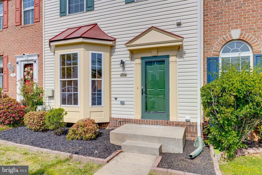 Monmouth Meadows at it's finest.  Welcome to 1954 Glenroths Drive.  Stunning 4 bedroom, 3 full bath, 1 half bath townhome with 3-story bump out!  Over 2300 total square feet of glorious living.  Freshly painted from top to bottom. Huge bay window bringing you sun-filled entry and dining room, with hardwood floors in main level.  Fabulous gourmet kitchen with stainless steel appliances, huge breakfast bar and breakfast room .  Formal dining room with tons of sunlight and  sliders opens to awesome deck with stunning view.  Deck has retractable awning for those hot, sunny days!  1/2 bath on main level.  Upper level affords massive master bedroom with a large walk in closet and Ensuite!  Luxurious Ensuite includes a soaking tub, stand up shower and double sinks.   2nd Full bath and 2 additional bedrooms adorn the upper level.  An entertainer's dream on the lower level offers cushy carpeting in family room and 4th bedroom. Separate exercise room or office.   3rd full bath in lower level.  Walk through the downstairs sliders to a stone patio, shed and spectacular views.  Virtual furniture is for visual concept only.  House does not have furniture.