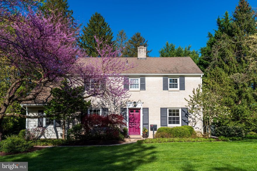 Welcome to 105 Pennington Road, an absolutely charming three bedroom, two and a half bath brick center hall Colonial, nestled on a gorgeous lot in the highly sought after Valley Hills neighborhood of Paoli. Located in the Tredyffrin-Easttown School District. This classic home is just one minute from the Paoli train station.  The spacious living room features a classic wood burning fireplace and a bump out enclosed with windows, providing tons of natural light. The formal dining room with wainscoting is the ideal setting for family meals and holiday celebrations. The heart of the home is the updated eat-in kitchen which offers raised-panel cabinetry, gleaming granite countertops, updated pendant lighting and backsplash, an updated dishwasher, stainless steel appliances, a large pantry and a spacious dining area.  The huge, sun-filled family room features a vaulted ceiling with skylights, a wall of windows overlooking the rear grounds and two sets of glass doors leading to a marvelous flagstone patio with an Old World stone retaining wall. A perfectly situated powder room completes the picture for the first floor of this terrific home. The second floor is home to the sumptuous owner's suite featuring a gorgeous, custom made and designed electric fireplace with built in TV, set within a beautiful stone backdrop and double closets. The spectacularly renovated owner's bathroom offers a seamless shower door and gorgeous tile work. Two additional, nicely sized bedrooms are serviced by a beautifully renovated hall bathroom. The lower level offers a terrific finished space with endless possibilities as a home office, workout room, playroom, online study center, etc., as well as a separate laundry room with storage area. The fieldstone patio overlooking the rear yard is the perfect setting for outdoor relaxing and entertaining, grilling and dining al fresco. Hardwood flooring,  an electric car charger, newer oil tank, gorgeous landscaping, mature shade trees, electric dog fencing, Old World Charm and so much more all combine to make 105 Pennington Road a very special place to call home. This home is a rare find and a tremendous opportunity. Located just minutes to the shops and restaurants of the Main Line, Friendship Park, Wilson Farm Park, Valley Forge National Park and the Paoli train station. Your search is over. Welcome home!