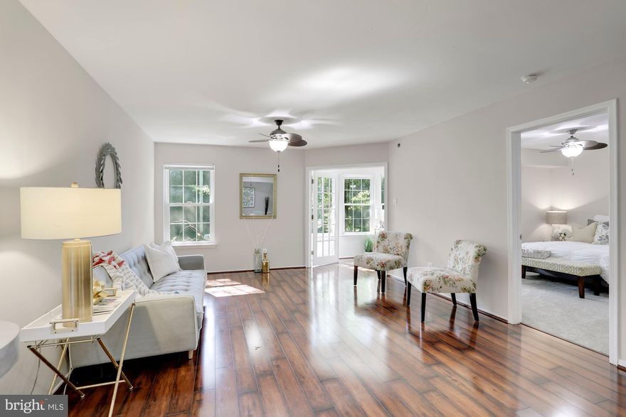 IMPROVED PRICE! (avg sales price 371K) Largest 2 bedroom/2 bathroom PLUS Den in the community! This corner unit home has been beautifully updated with new carpet in the bedrooms, fresh paint throughout, all new electrical outlets, and many other details. Open kitchen has stainless steel appliances and a brand new microwave and disposal. One assigned garage parking space under this building is rare and this one is right near the door, plus one visitor pass! The open concept living space is perfect for entertaining with laminate wood flooring for low maintenance living. Working from home and need dedicated office/work space? The sun filled den would make a perfect office/nursery/exercise room/reading lounge/ craft room or study. Two spacious bedrooms on opposite ends provides for added  privacy, as two master suites essentially. One has a private bath with two separate closets and the other has a large walk-in closet; with access in the jack-n-jill bathroom. This bathroom has lot's of counter space, an updated vanity for additional storage and brand new ventilation fans with integrated Bluetooth-enabled stereo speakers and LED lights that switch to cool blue or amber warm night lights.   Gated community with amenities galore include: pool, hot tub, sauna, fitness center, community/party room, dog park, basketball court, grilling/picnic stations, playground, car washing station and daily shuttle to the Pentagon City Metro (M-F every half hour from 6:30-9:30am and 4:30-7:30pm) Walking distance to Shirlington, XSport, and the newly built Silver Diner and Harris Teeter coming soon. One mile from the Bradley Center and Bailey?s Crossroads for all your shopping needs! Community is welcoming, social, and VERY pet friendly!