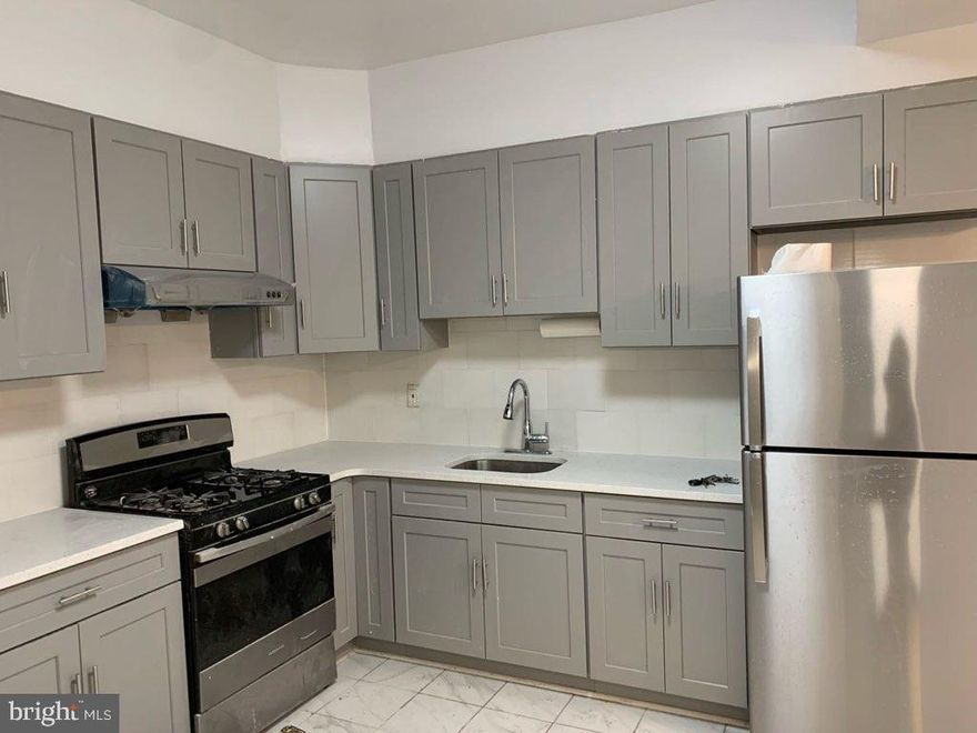 Need more space? Check out this completely renovated and modern 4 bedroom/2 bath apartment in a, free-standing quadplex, conveniently located close to the Transportation Center (with direct trains to center city Philadelphia), the county courthouse and offices, and the major through-roads in and out of town. It sits on a quiet, one-way street in an historical and architecturally quaint part of town. Other features include: Central Air, first floor entry, a porch, and onsite parking.  New refrigerator, washer and dryer are also included! Landlord pays some utilities (see details).  Make your appointment to see this great home which is available now. Be part of up and coming Norristown! (First mo, last mo, and one month security required up front.)