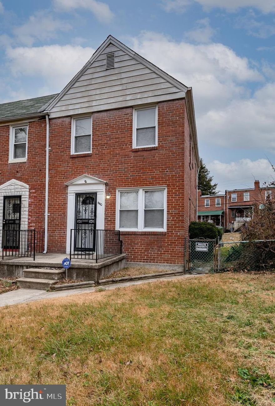 Brick home on a nice street.  Enjoy 3 levels of living in this semi-detached home.  Spacious yard. Easy parking in the front but also your own private parking in the rear of the home. Updated kitchen and baths.  Hardwood floors throughout. Finished basement with bonus room.  Central air. Make this home special by bringing your special touches, sweat equity and tlc.  Easy updates. Sold as-is.