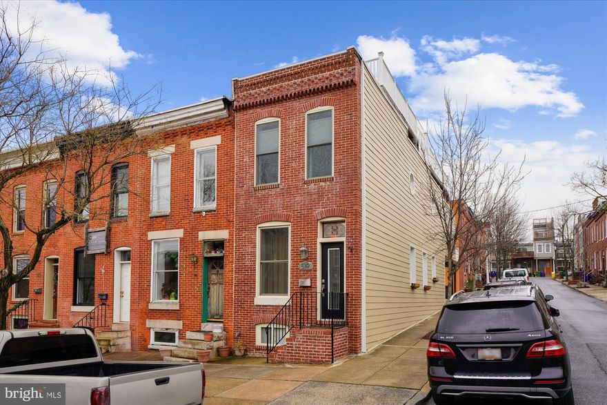 This house checks every box there is. Incredible end of group town home featuring 2  CAR off street parking (covered by a deck), an open floor plan flooded with natural light, and 3 larger ensuite bedrooms. Side entry from parking pad is an office but could also be a mud room, dog room, rec room, etc. Plenty of outdoor space with a large private deck off of the primary bedroom and an even larger 2 tier roof deck with amazing vantage points of both water, city, and the Iconic Domino Sugar sign. Perfect for entertaining. Bedroom level laundry. Recent Improvements: Hardie Siding Installation (2018), Roof Replacement (2018), Roof Entry Siding Replacement (2018), Front Door Replacement (2019), HVAC Replacement (2020), Reme-Halo Air Purifier (2020).  See floor plan tour in virtual tours.