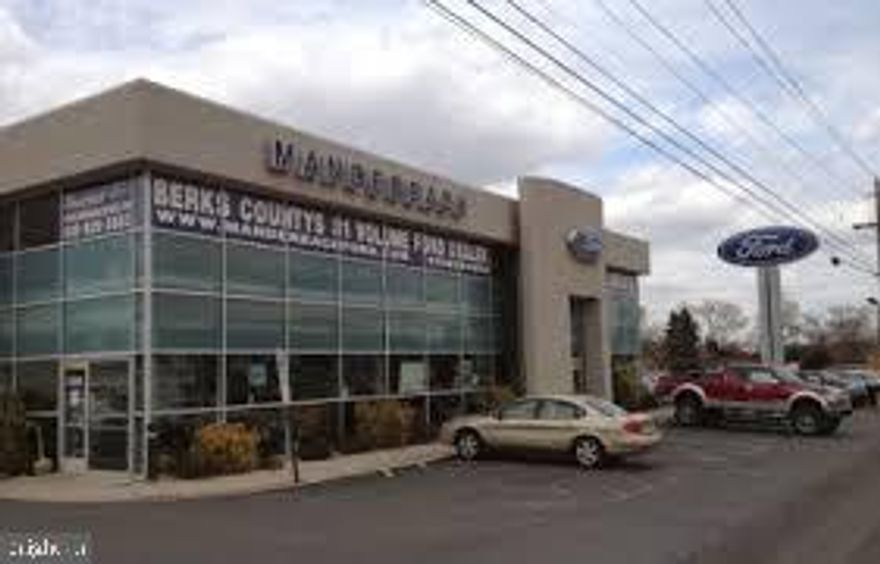 Former Manderbach Ford location on 7+ Acres!  Property includes 1)  27,345 SF Main Building consisting of a)  Showroom (5,318 SF), b)  Mechanics Shop (16,784 SF)  w/ 18' ceilings & 8 drive in doors and c)  Second Floor office/storage (5,243 SF);  2)  Detail Building w/ 6 overhead doors (3,922 SF); and 3)  Body Shop (7,665 SF) w/ 5bays & drivethru overhead doors.   C-3 Commercial Zoning with 586' frontage along 5th St. Hwy.  Acreage/ Buildings can be Divided.  100+ Car Parking.  Lease Possible.