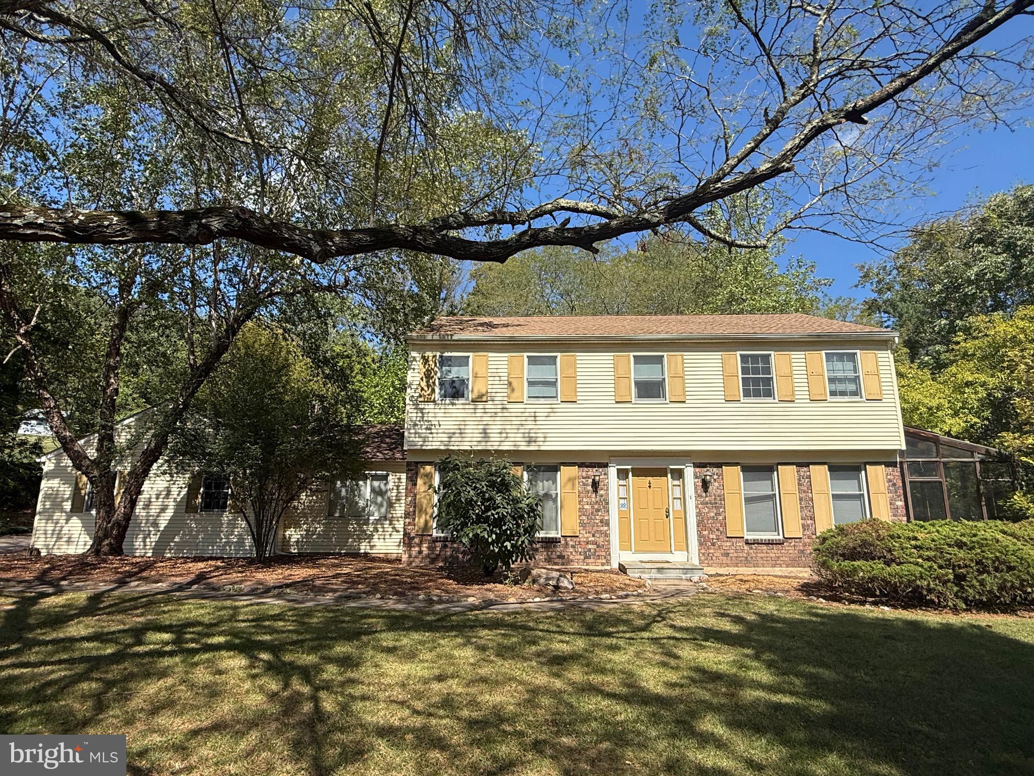 Great opportunity to own a 4 bedroom, 2.5 bathroom colonial home in highly desirable Pebble Woods, Doylestown! Proudly situated on over an acre, this property offers privacy in a quiet, established neighborhood. The home is ready for a fresh start and has great bones. It’s traditional open floor layout awaits your vision! As you walk through the front door, to the right is a large living room and to the left is the dining room. The eat in kitchen with two pantries opens to the cozy step down family room with large wood burning fireplace. Off the family room is a spacious newer trex deck for outdoor enjoyment. The main floor also includes an office that can be used as a playroom. A laundry room, half bathroom and a large three season room are also on the main floor. Up the stairs to the second level you will find the large primary bedroom with a walk-in closet and private bathroom. Three additional bedrooms and a full bathroom round out the 2nd floor. This home has a new roof on the main part of the house and a new security system. It has incredible potential and is being sold as is. Conveniently located near 313, 202, 263 and downtown Doylestown shops and restaurants!