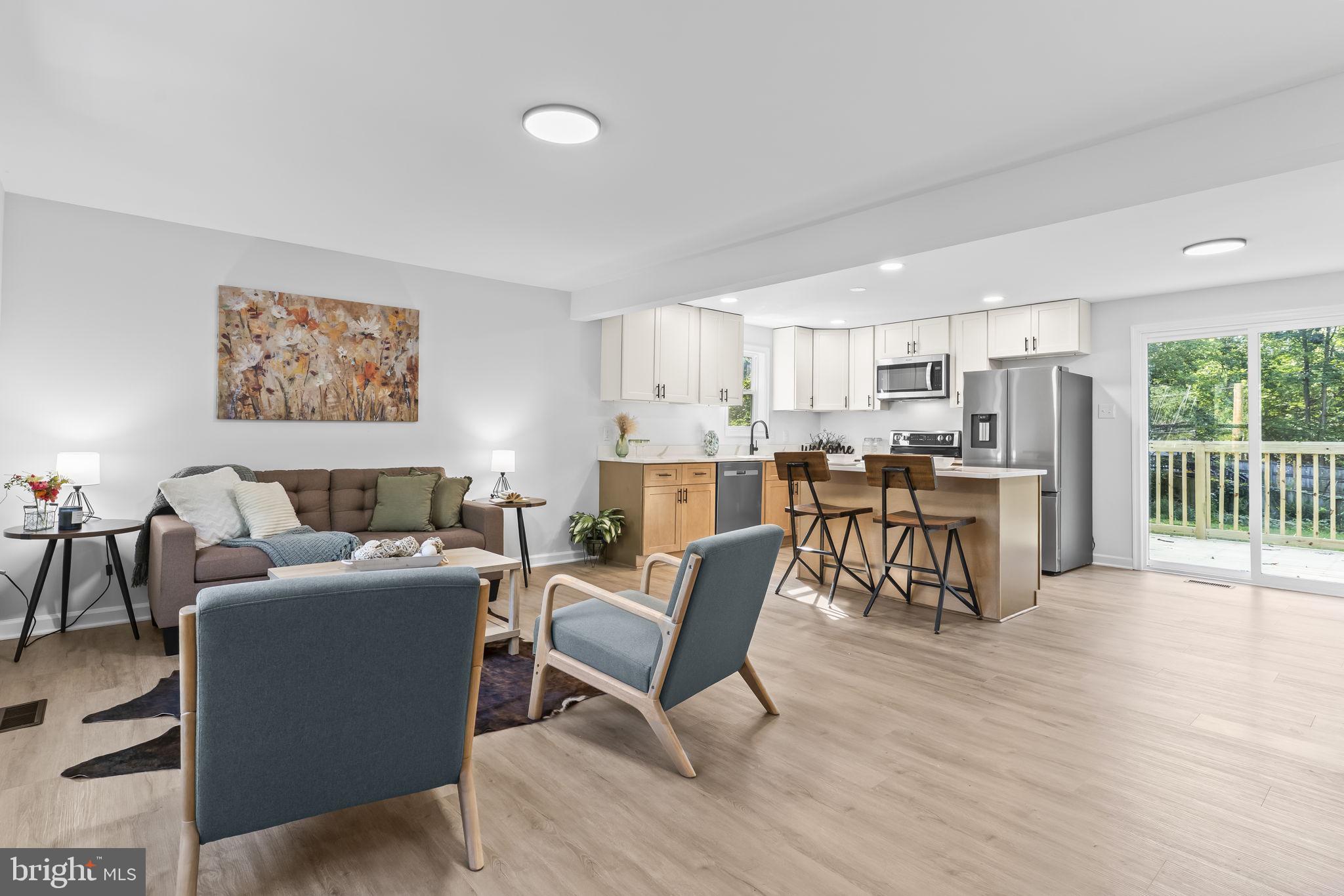 This great home qualifies for the Maryland Mortgage Program which means you can get down payment assistance creating a 100% financing program! This super cute renovated home offers three bedrooms and two full bathrooms, beautifully updated with fresh finishes throughout. The brand-new kitchen is a showstopper, featuring new cabinets, quartz countertops, stylish lighting, and plenty of space for cooking and entertaining. The bathrooms have been tastefully updated, and the home also boasts new LVP flooring and fresh paint, giving it a modern and inviting feel.
Step right out from the kitchen to a brand-new deck, perfect for grilling and gathering with family and friends. The large, cleared backyard is ideal for kids to run and play or for pets to enjoy. Major updates include a new roof, new siding, and a new walkway, making this home move-in ready with peace of mind for years to come.
Conveniently located close to shopping and everyday amenities, this home combines charm, comfort, and convenience. Don’t wait—this one won’t last long! Seller is a licensed Realtor in Maryland and Virginia.