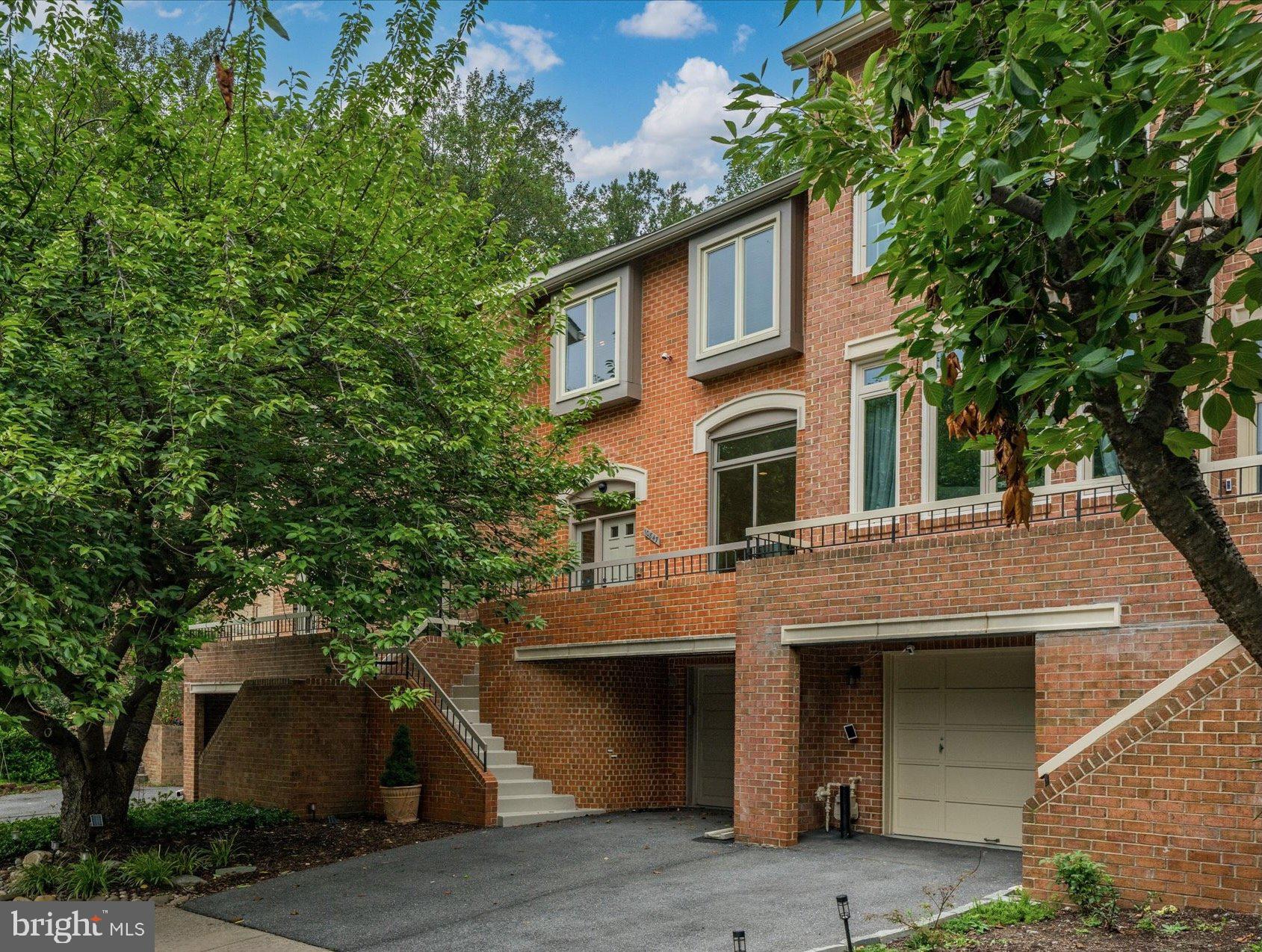 Welcome to 10847 Whiterim Drive, an exceptional townhome in the highly sought-after Woodrock community of Potomac, Maryland. Offering three bedrooms and three-and-a-half bathrooms, this residence showcases a desirable floor plan designed for both comfort and style. From the freshly painted front patio to the brand-new entry door, the home sets a warm and inviting tone from the moment you arrive. Enter and ascend to the open living area, where natural light pours through a dramatic oversized window, highlighting the gleaming hardwood flooring that spans the main level. Step up to the dining area that seamlessly connects to the kitchen—an ideal layout for entertaining. The kitchen is equipped with stainless steel appliances, granite countertops, a custom tile backsplash, and a cozy eat-in nook. From here, step out to the beautifully updated wood deck, enhanced with added posts for exterior lighting—perfectly designed for effortless outdoor gatherings and evening relaxation. A powder room and hall closet round out this main level.
Upstairs, three bedrooms and two full bathrooms await. The primary suite stands out as a true retreat, featuring vaulted ceilings, a generously sized walk-in closet, and a sunlit sitting area wrapped in windows. The en-suite bathroom offers dual vanities, a walk-in shower, and an oversized tub. Two spacious secondary bedrooms, each with vaulted ceilings, share a hall bathroom featuring a combined shower and tub.
The lower level of this home is a versatile extension of the living space, centered around a charming brick-surround wood-burning fireplace that serves as the focal point of the room. A large egress window invites natural light. This level also includes a full bathroom with a walk-in shower, a dedicated laundry room with a front-loading LG washer and dryer, and direct access to the one-car garage.
Woodrock is a special community, ideally located just minutes from Potomac Village, I-495, and the Clara Barton Parkway—offering unmatched convenience for shopping and commuting. Just steps from your front door, endless outdoor adventures await—biking, kayaking, fishing, and birding are all within easy reach. At the end of the road, quiet Great Falls National Park hiking trails lead you into nature, while nearby you will find world-class recreation, a scenic gravel trail to Georgetown, the breathtaking waterfalls of Olmsted Island, and a rich history unique to this corner of the DMV. With its rare floor plan and thoughtful updates, this home is a special opportunity!